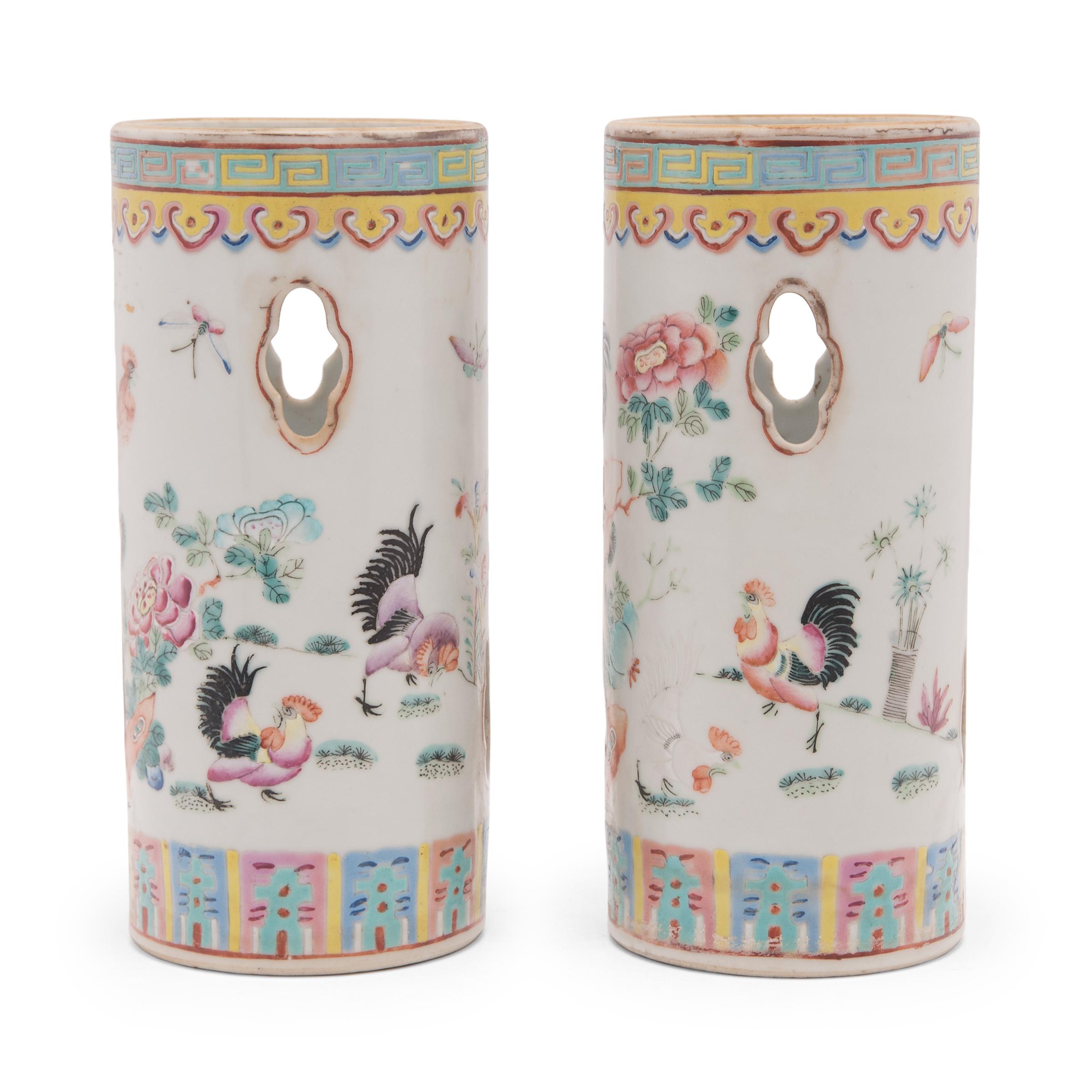 Brilliantly colored with pastel enamels, these porcelain hat stands were once used by a Qing-dynasty gentleman to display his caps while they weren't in use. The hat stands are decorated in the famille rose style, a decorative technique that employs