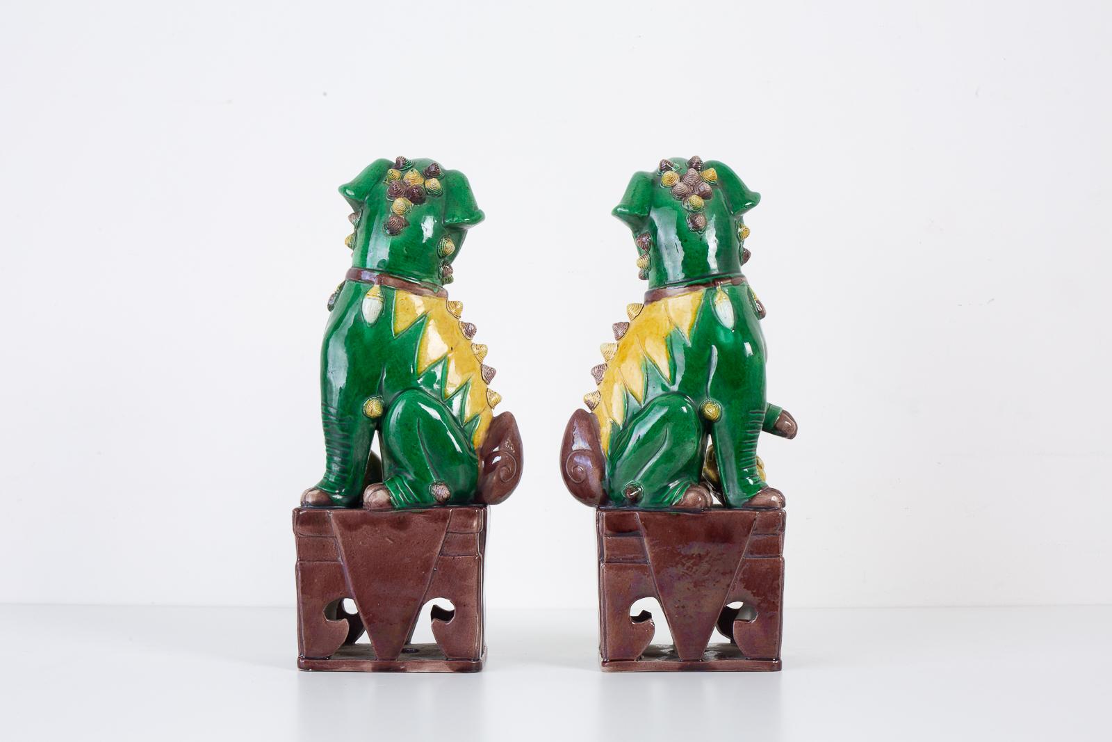 Hand-Crafted Pair of Chinese Famille Verte Foo Dogs on Stands For Sale