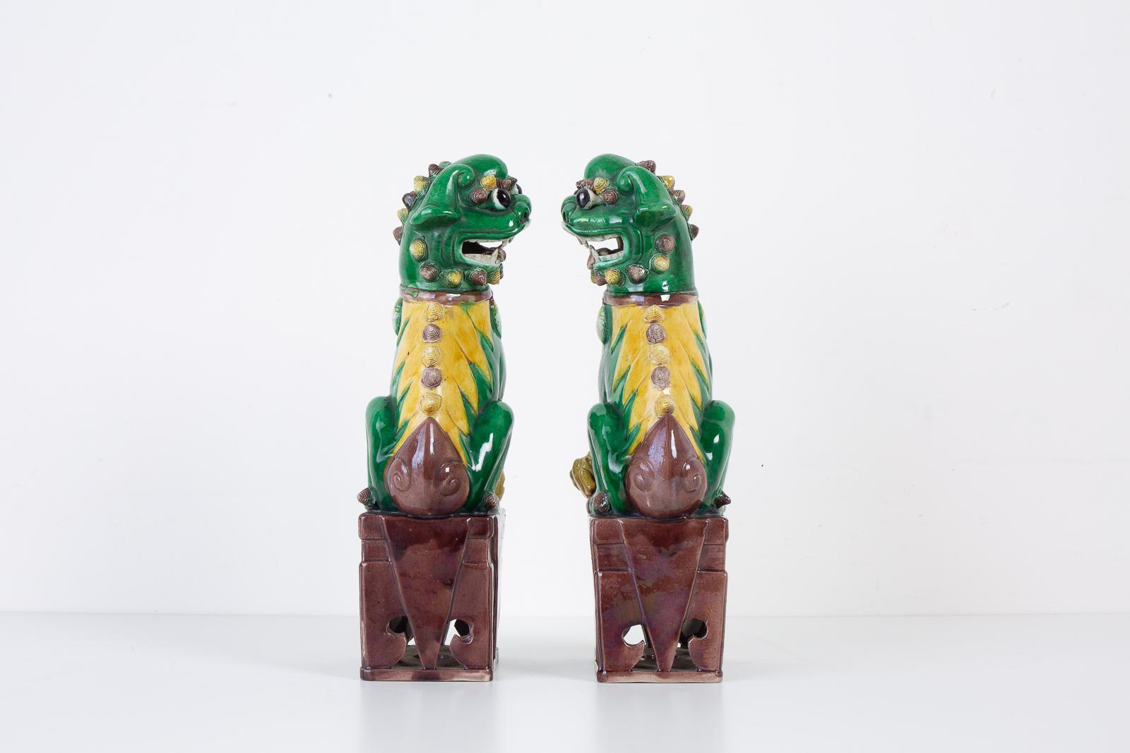 20th Century Pair of Chinese Famille Verte Foo Dogs on Stands For Sale