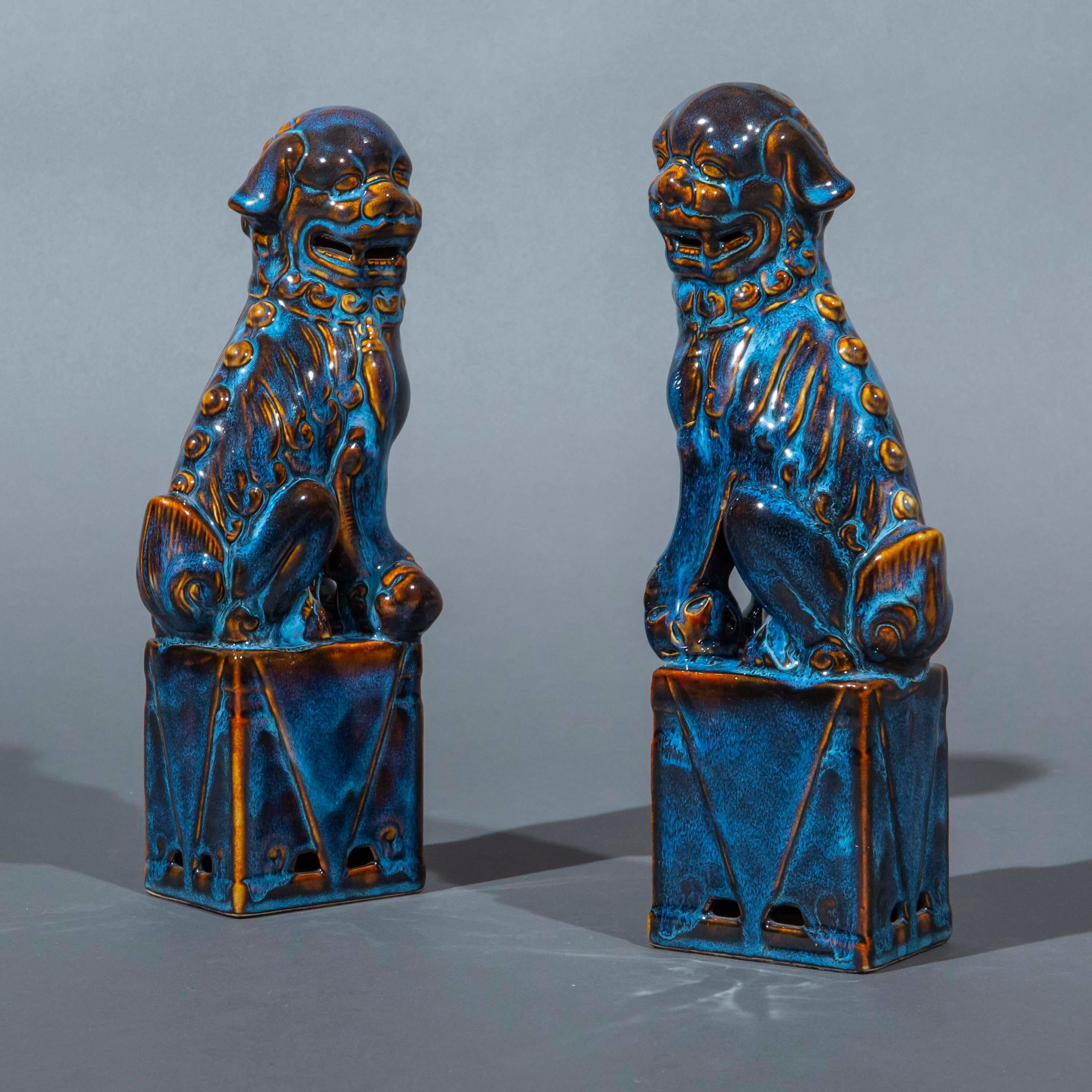 A wonderfully decorative pair of porcelain foo dogs, or guardian lions, beautifully glazed with purple and blue streaks
China, 20th century

Why we like them
We love the opulence of colours and the intricate pattern of the glaze. Very decorative