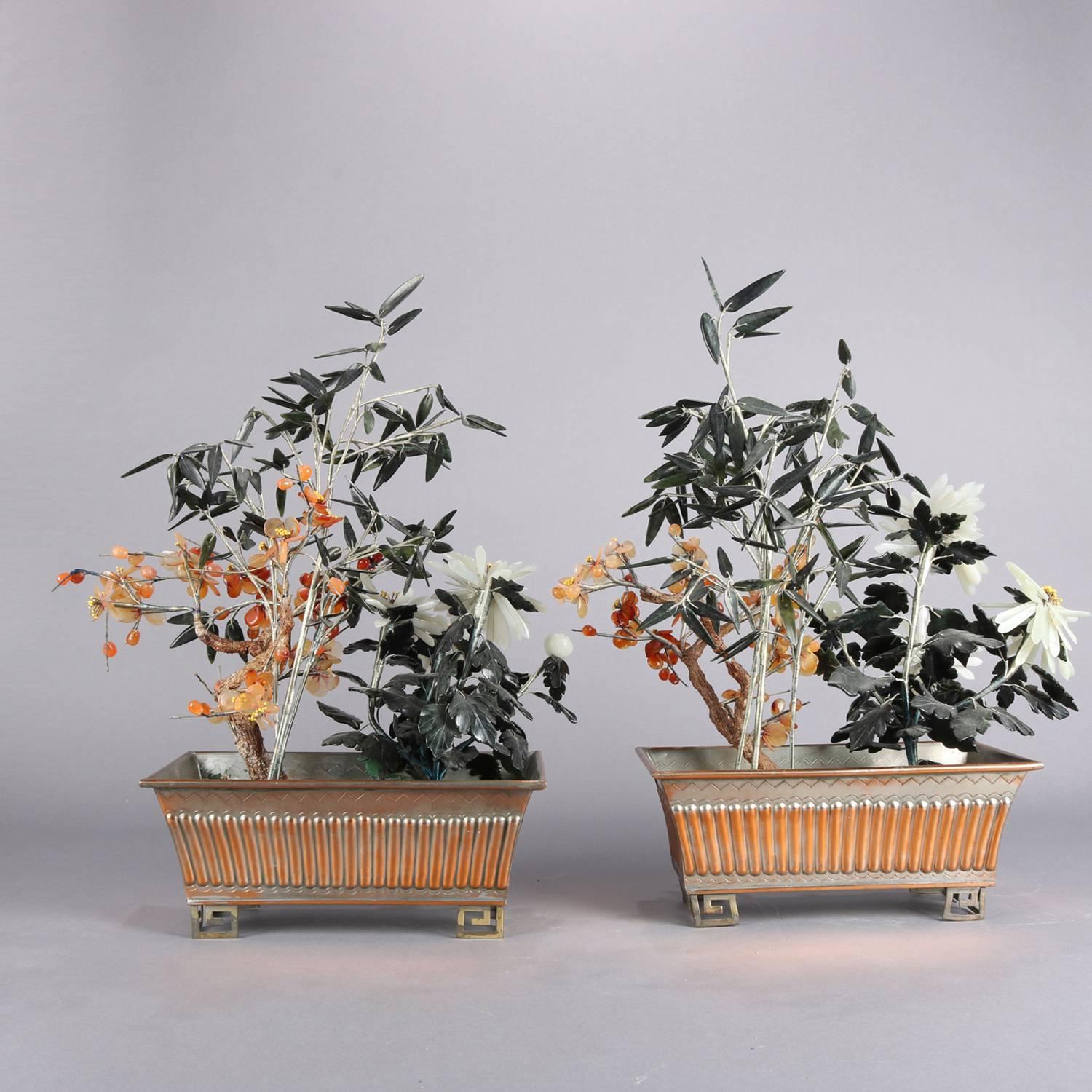 Pair of Chinese jade Bonsai trees feature floral and bamboo in ribbed metal pots seated on Greek key feet, 20th century

Measure: 18