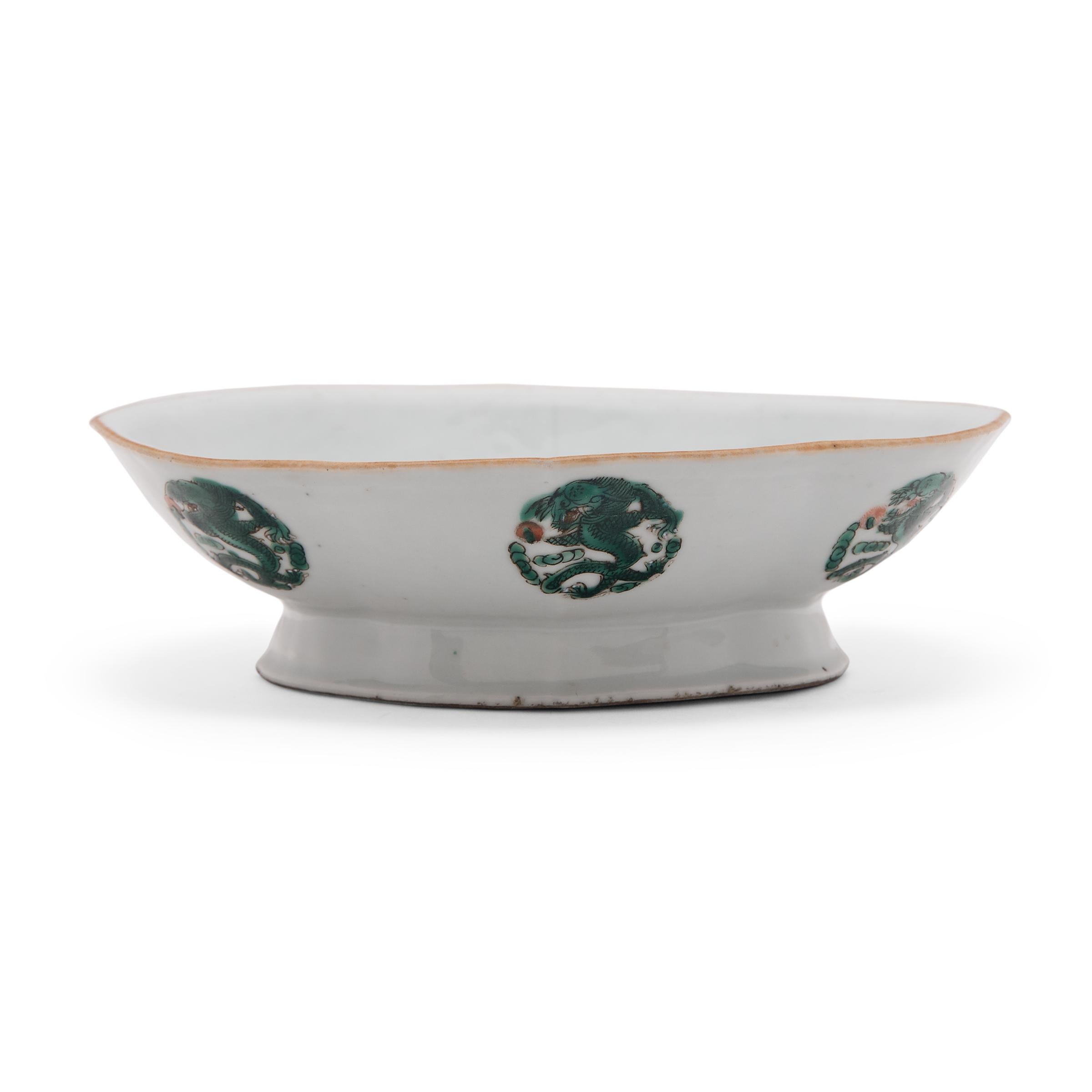 These porcelain bowls date to the mid-19th century and were originally used as serving dishes for ritual offerings, placed before a home altar and piled high with fruits, baked goods, and other foods. Each dish features a short footed base and a