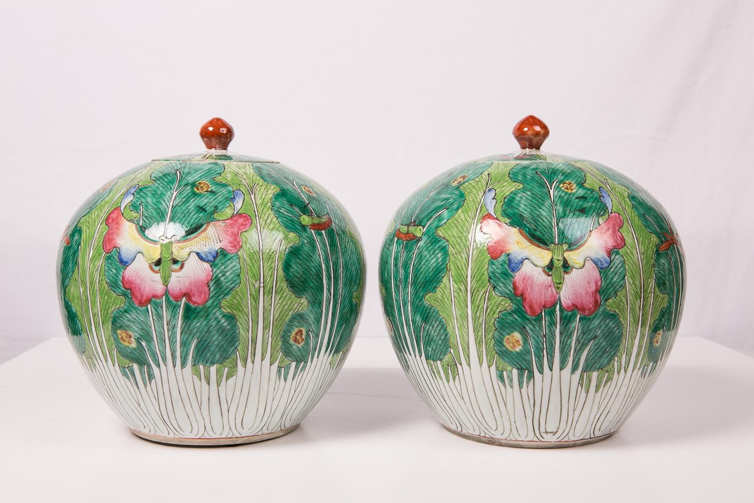 WHY WE LOVE IT: Who doesn't love pink and green?
We are pleased to offer this pair of Chinese ginger jars with cabbage decoration dated to the Xianfeng reign of the Qing dynasty (1831-1860). The jars are vividly decorated with cabbage leaves in