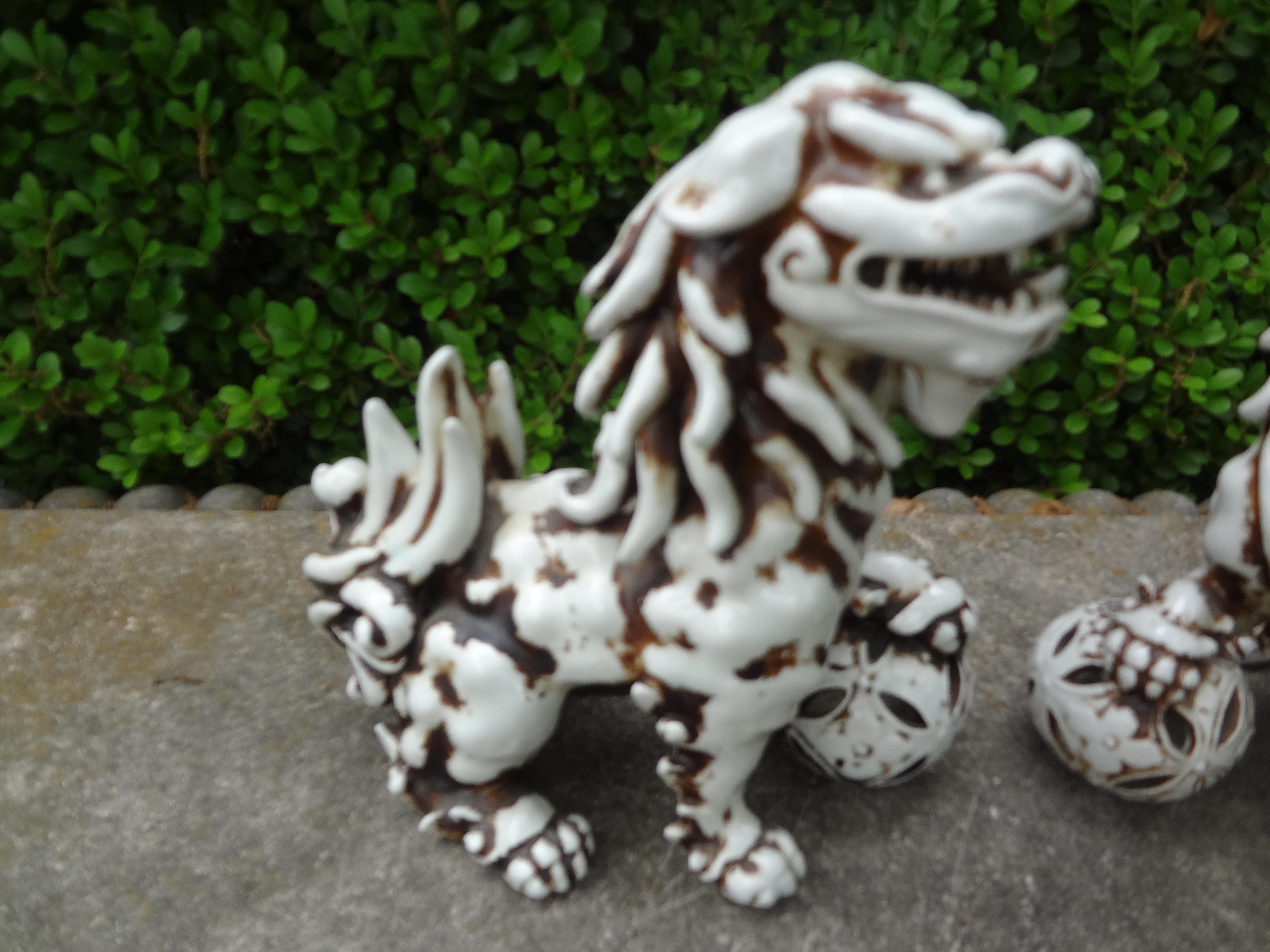Pair Of Chinese Glazed Ceramic Foo Dogs In Good Condition For Sale In Houston, TX