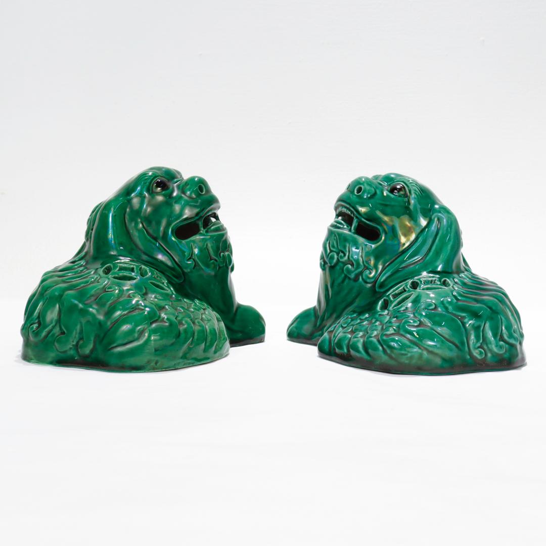 Pair of Chinese Green Glazed Pottery Recumbent Foo Dog Figurines In Good Condition For Sale In Philadelphia, PA