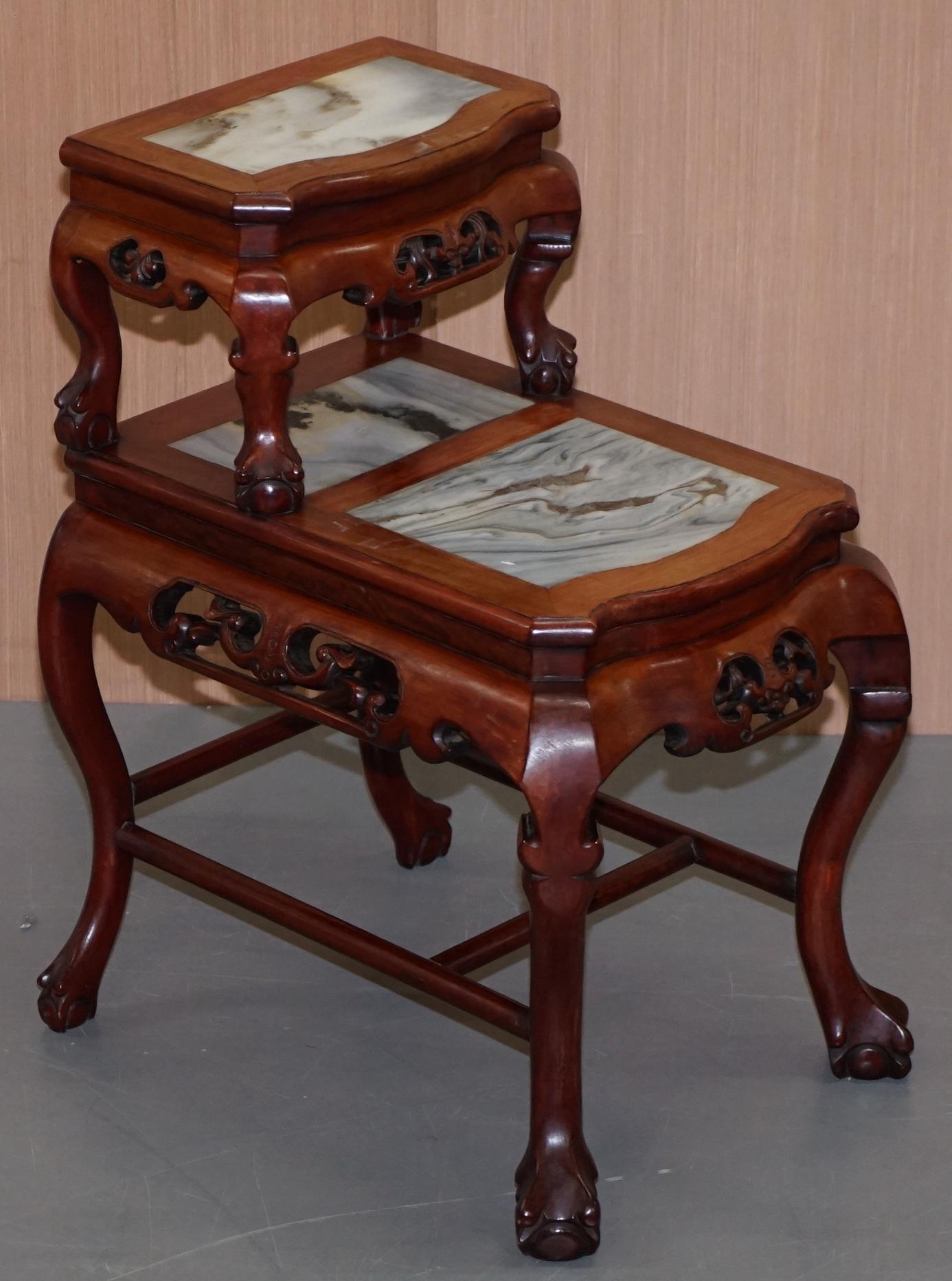 We are delighted to offer for sale this stunning pair of late 19th century hand carved Hardwood with marble inset tops and claw and ball feet tiered side tables

A very good looking and well made pair, I have never seen them tiered like this before,