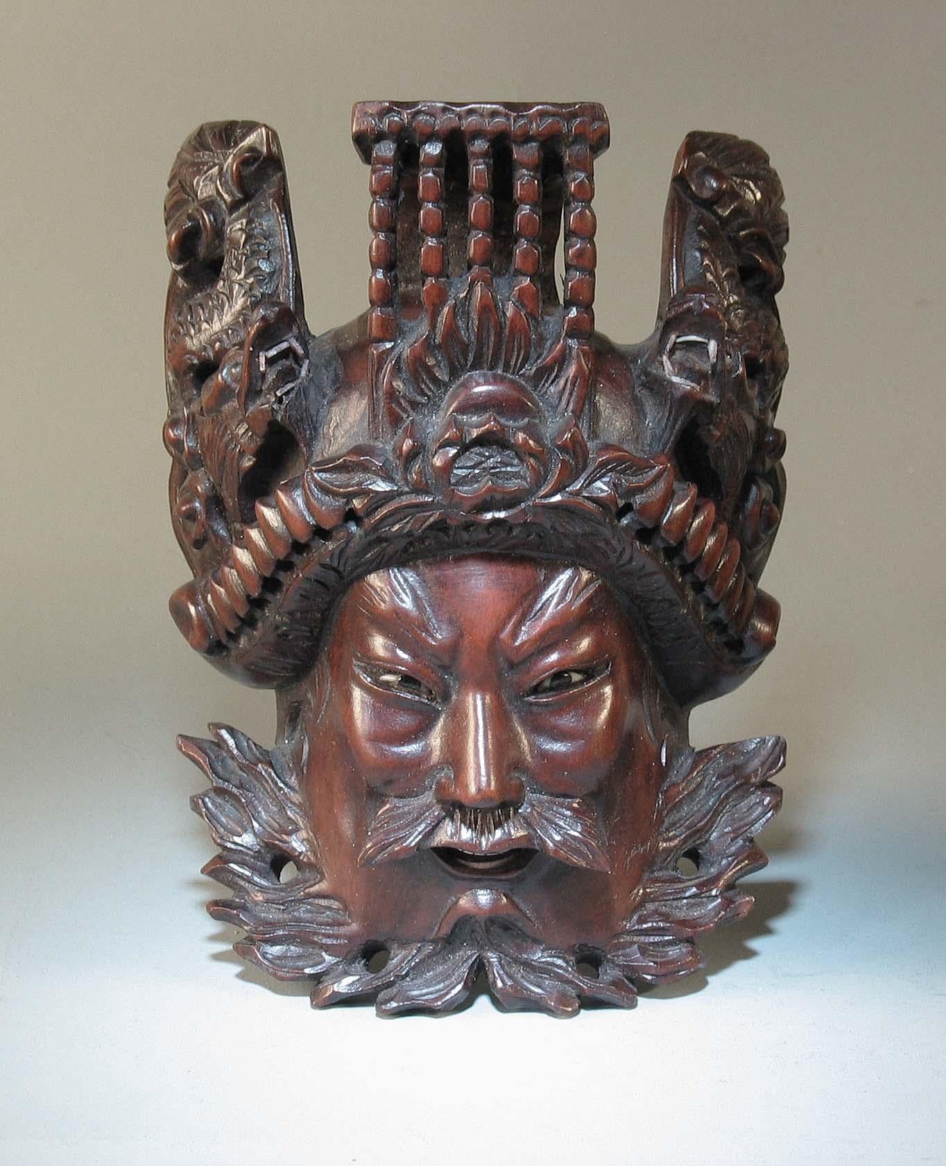 A Pair of Chinese Hand Carved Rosewood Masks of Daoist Deities In Good Condition In Ottawa, Ontario