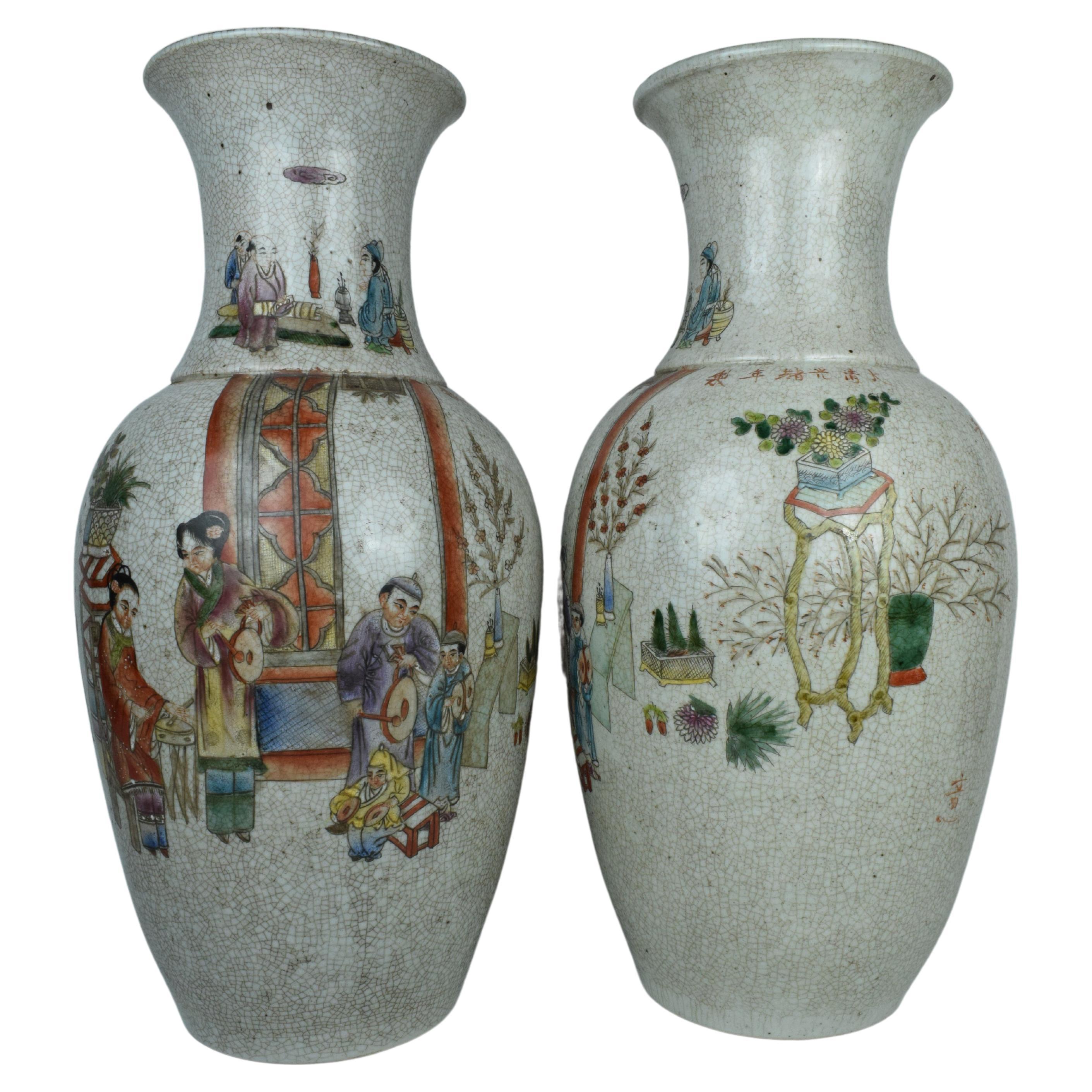 The pair of Chinese hand-painted porcelain vases are exquisite examples of traditional Chinese artistry, capturing scenes of daily life and celebrating the rich cultural heritage of China. These vases l showcase a combination of detailed painting,