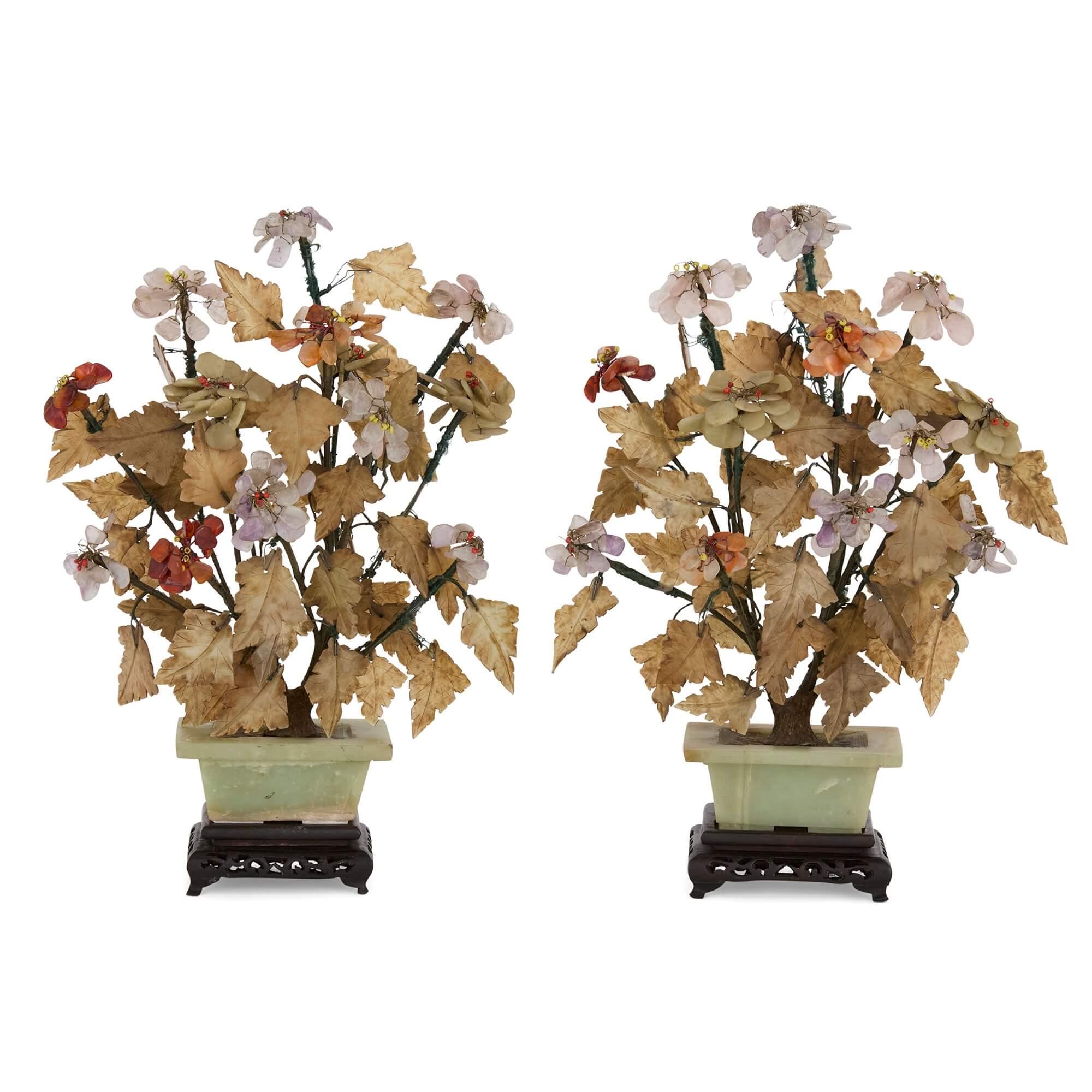 Pair of Chinese hardstone and jade flower models
Chinese, 20th Century 
Height 33cm, width 25cm, depth 17cm 

This superb pair of hardstone flower models are almost identical in design, comprising hardstone trees set within rectangular jade