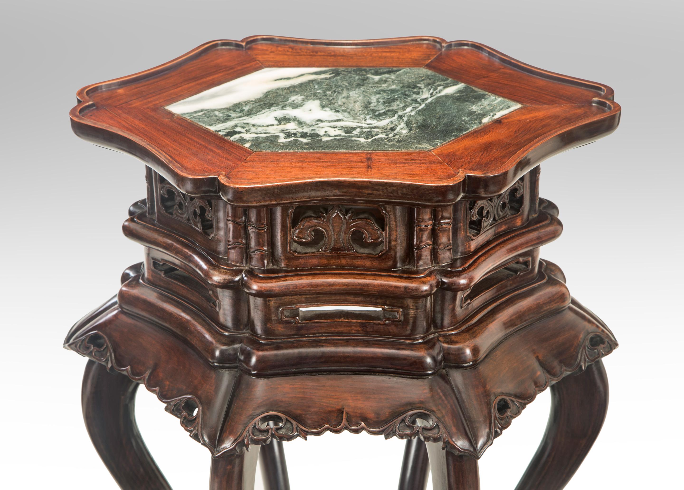 Pair of Chinese hardwood tables with inset marble tops
Late Qing Dynasty, 19th century
Stunning tables of unusual quality. Each shaped six-sided top inset with a beautiful figured marble, above a pierced frieze and foliate apron, raised on six