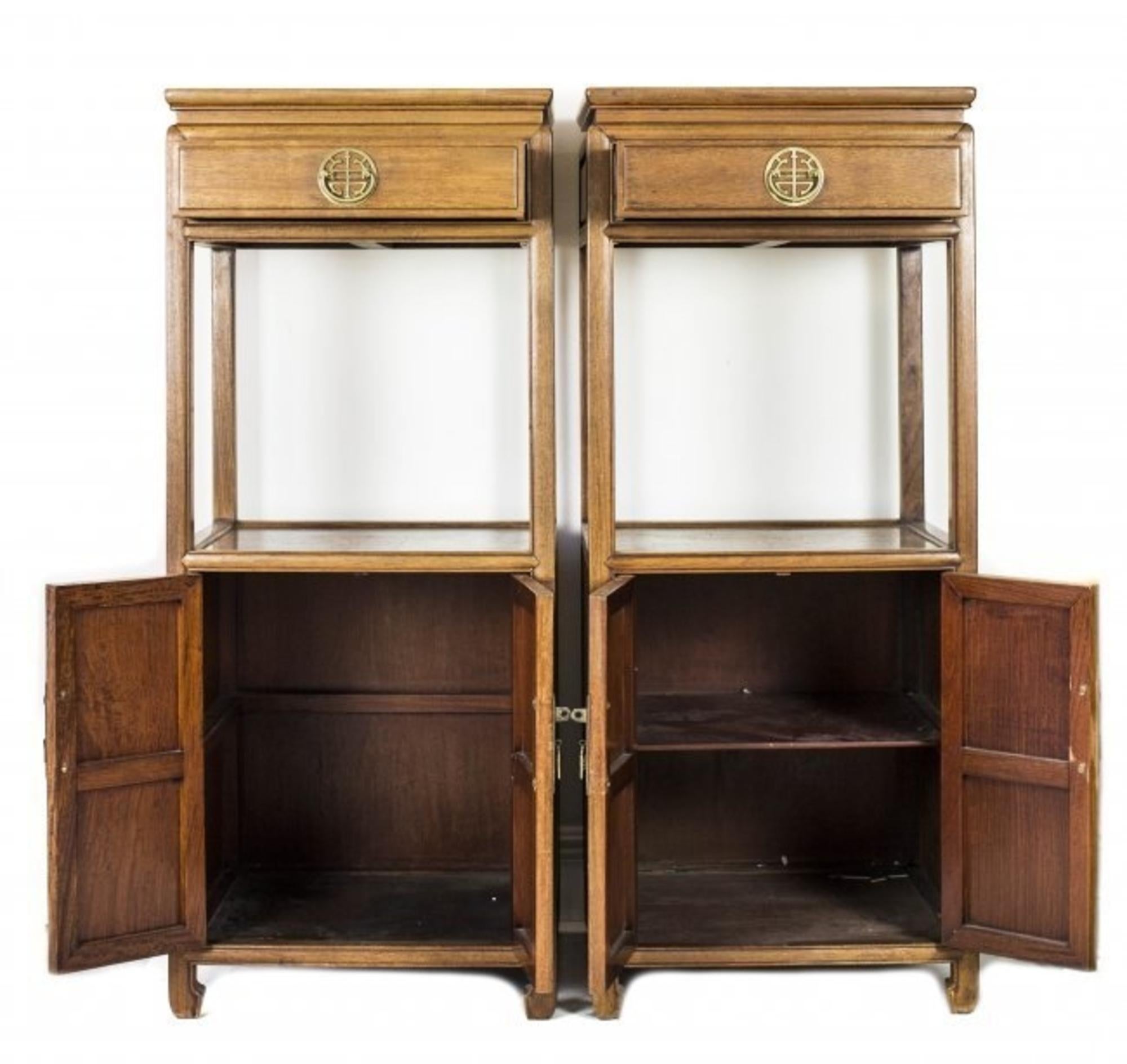 Pair of Chinese Hong-Mu pedestal cabinets
Each of rectangular form fitted with an upper drawer and a pair of cupboard doors.

Measures: Height 4 ft. by 2 in.,
Width 21 in., Depth 19 in.
