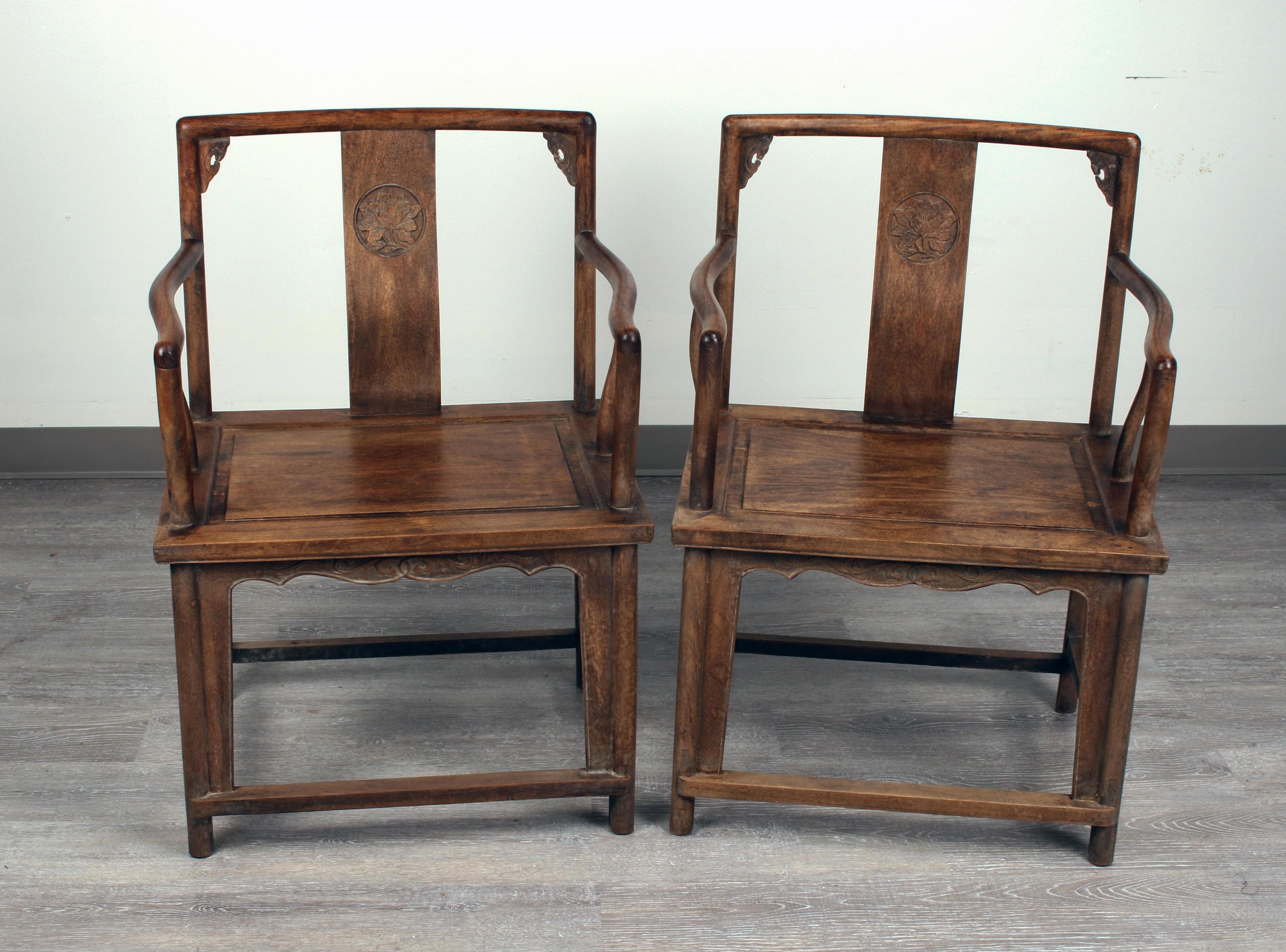Pair of Chinese Huanghuali arm chairs and carved Floral Medallion on the center of the backsplat, and with gracefully curved arms having a rich natural patina and distinctive grain.
They were made by hand with no nails, very sturdy and firm, supper