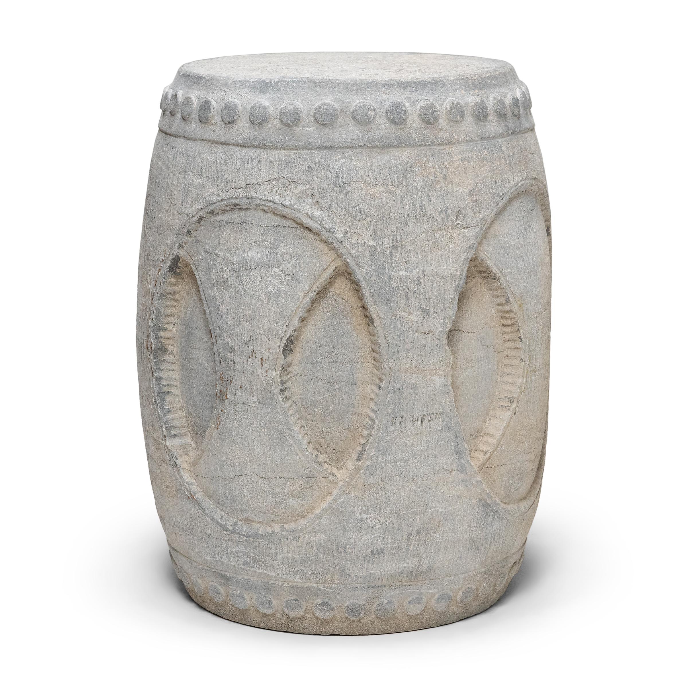 Drum-form stools such as these were traditionally used in gardens and outdoor pavilions where upper class scholars read, wrote, gathered for discussion and, in general, developed their inner sensibilities. This contemporary example was carved from