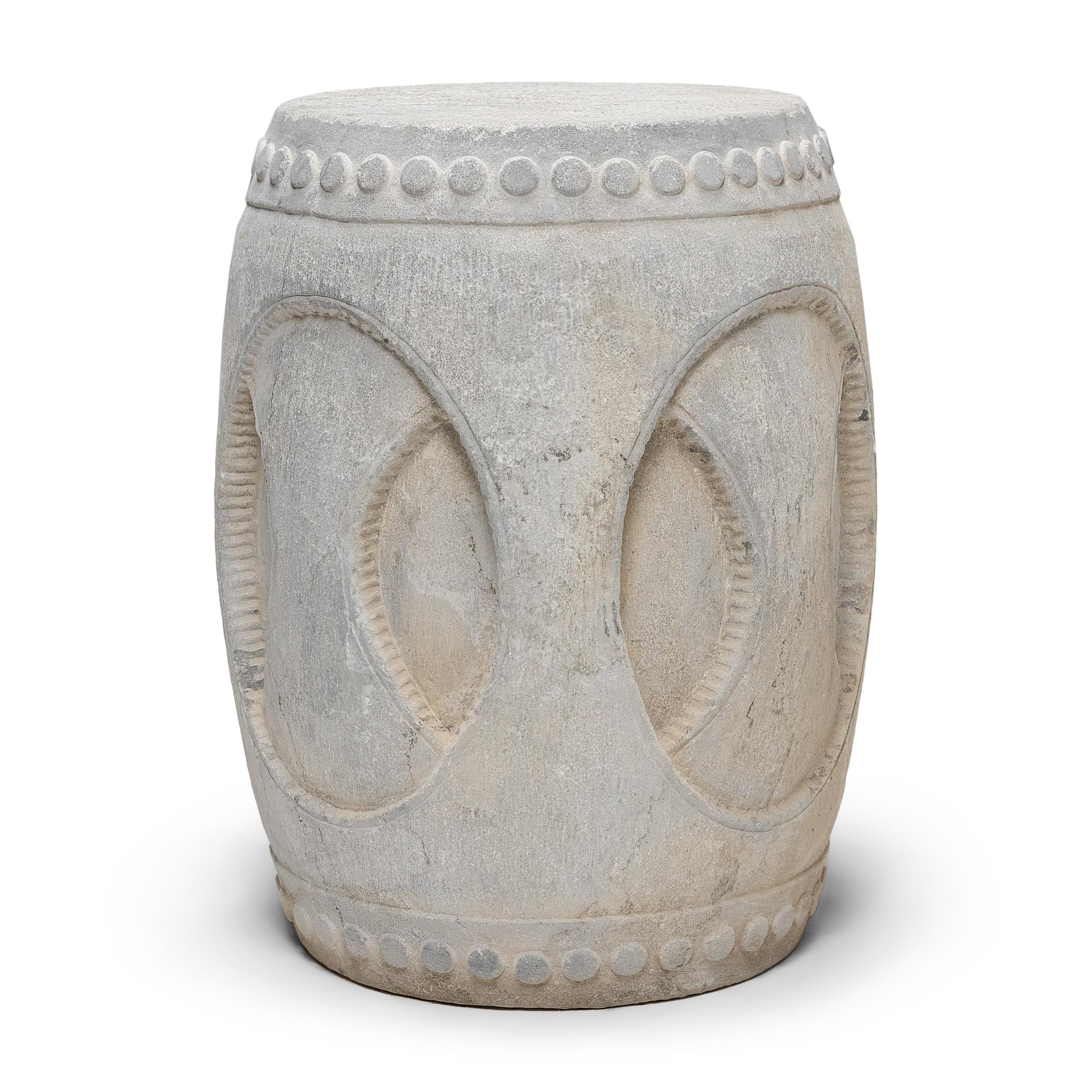 Drum-form stools such as these were traditionally used in gardens and outdoor pavilions where upper class scholars read, wrote, gathered for discussion and, in general, developed their inner sensibilities. This contemporary example was carved from