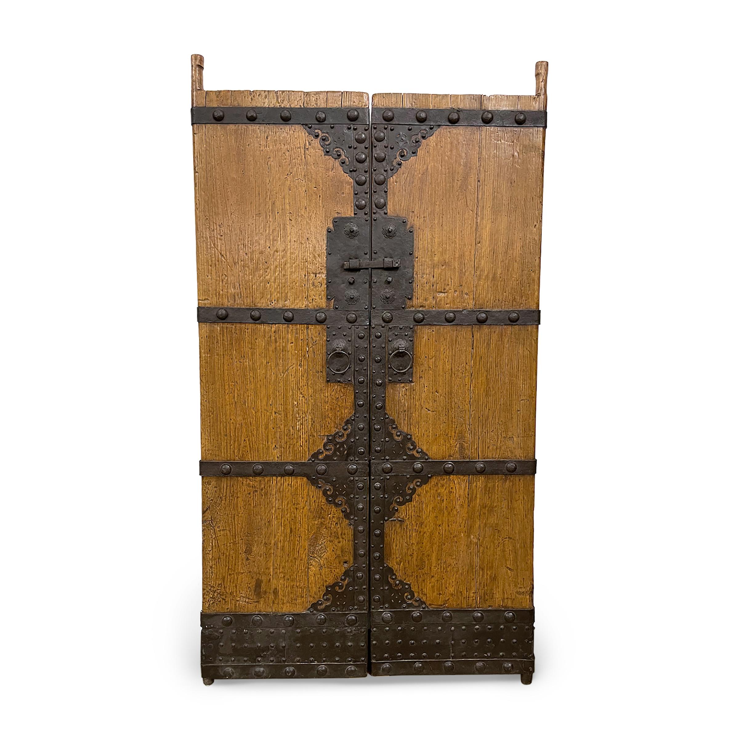 This monumental pair of doors dates to the mid-19th century and once enclosed the inner courtyard of a grandQing-dynasty home in northern China. The courtyard doors are crafted of northern elm (yumu) and are complete with the original door frame