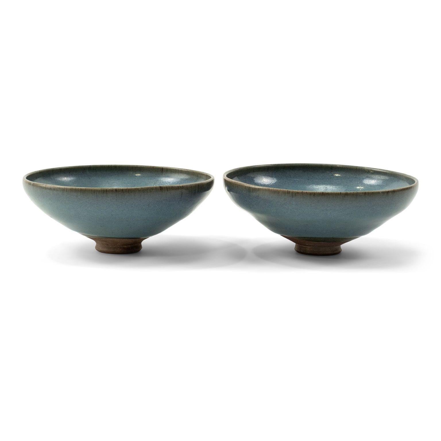 Pair of Chinese Jun ware bowls, Yuan dynasty (circa 1250-1400): Large Jun Yao, purple splashed stone ware bowl Yuan Dynasty, China. Well potted, on a neatly cut splayed foot, the bowl is applied with thick pale blue glaze, splashed with a patch of