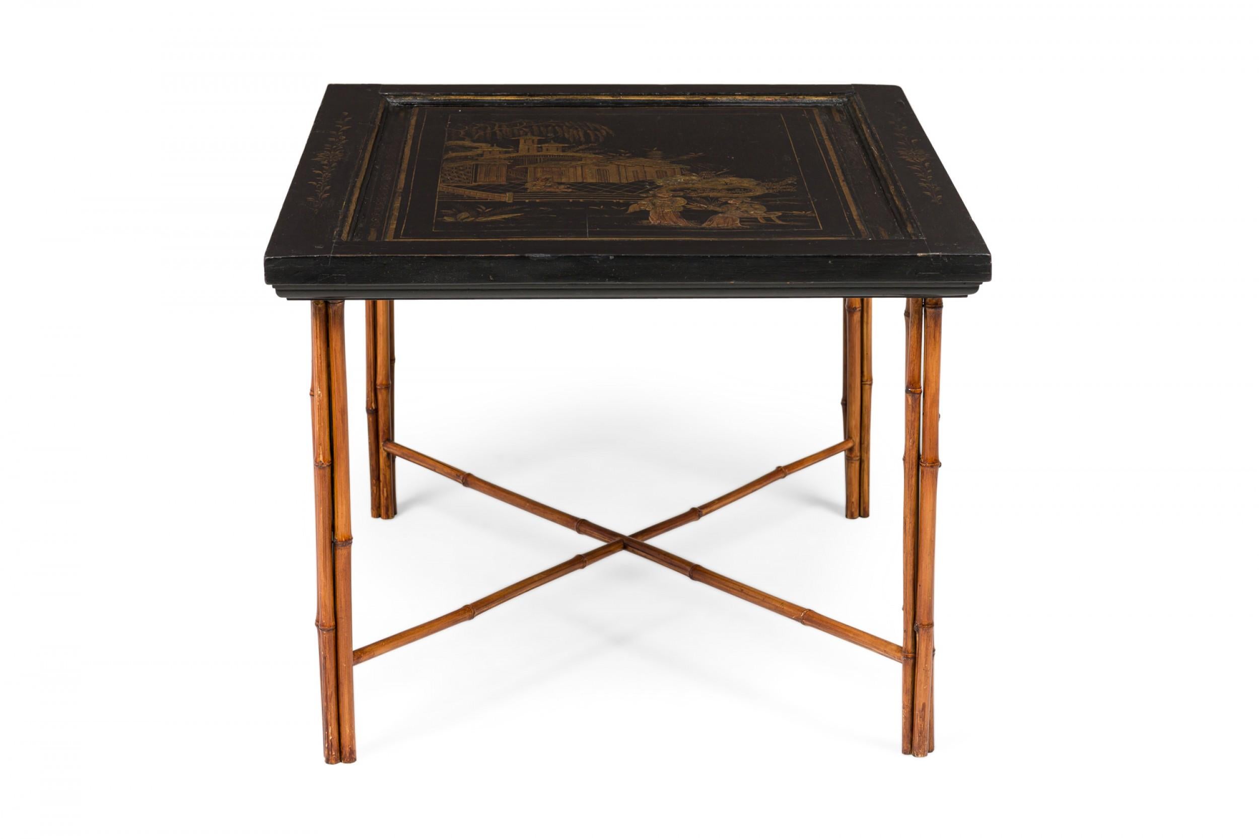 Pair of similar Chinese end tables with black lacquered panel tops (19th Century) having figural and parcel gilt highlights within an inset painted floral border resting on bamboo cluster legs connected by an X-stretcher. (PRICED AS PAIR) (Prov: