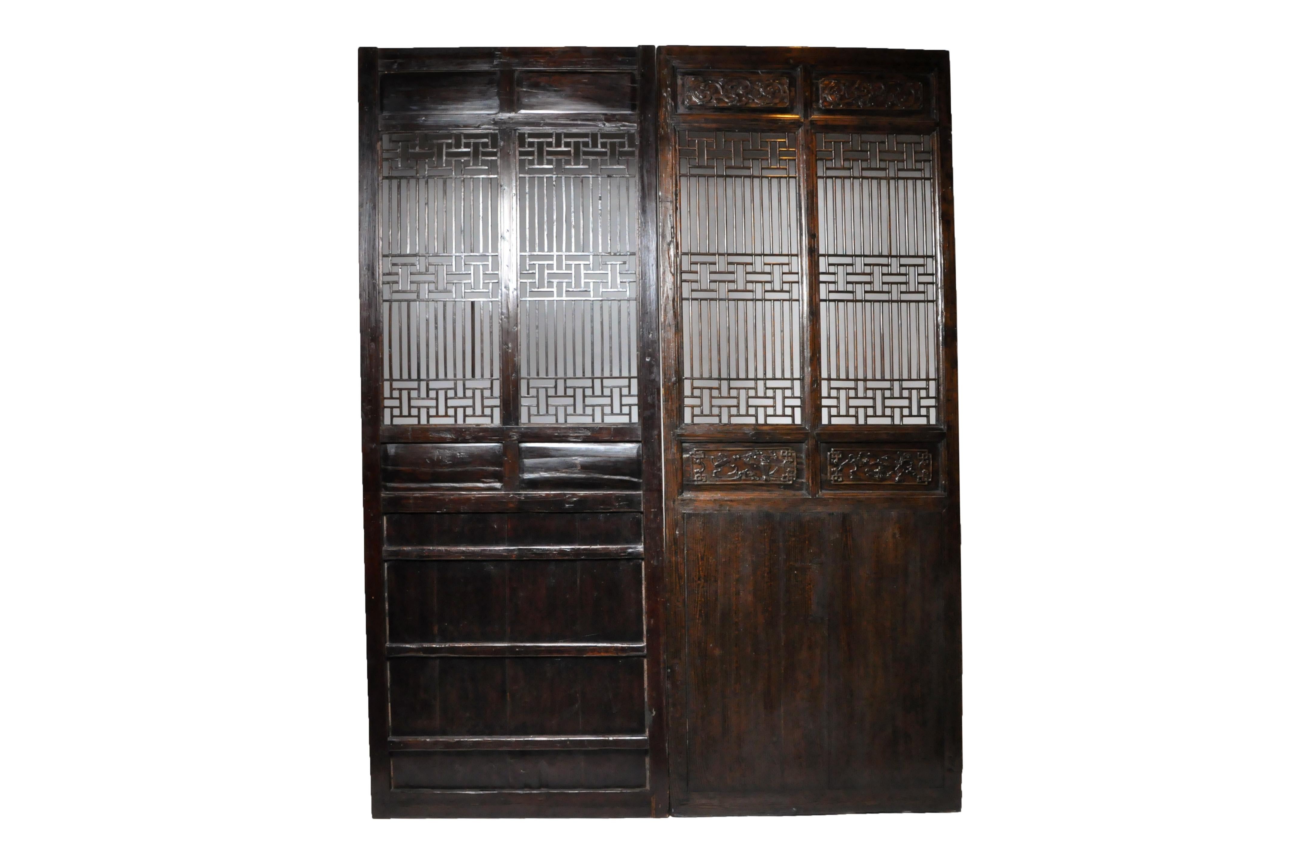 This pair of Chinese lattice panels were made from Fir wood and lacquer. They were found in Zhejiang in the early 1800s. Wear consistent with age and use.
   