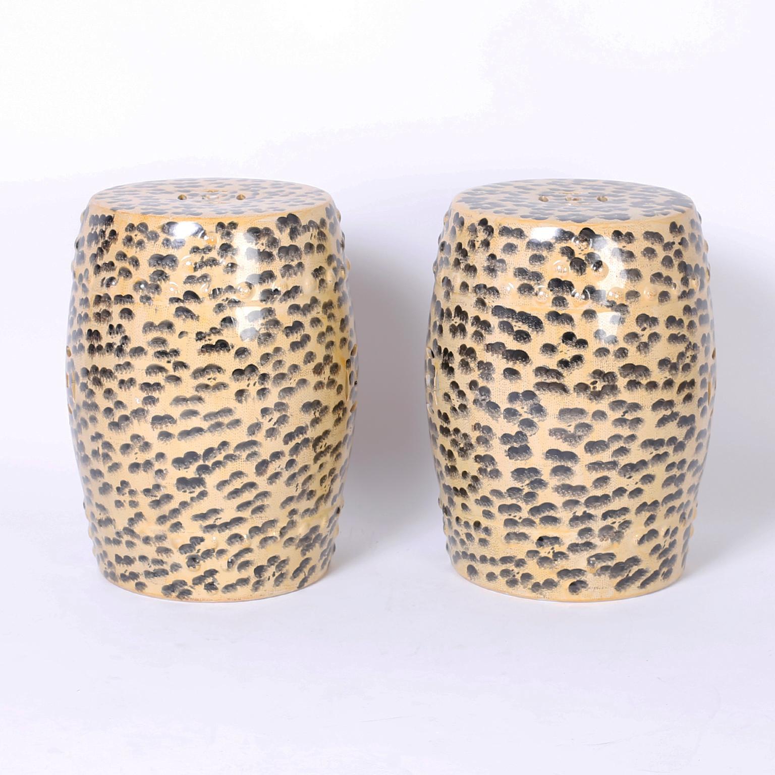 Chic pair of Chinese porcelain garden seats with a Classic form hand decorated with the unexpected, yet welcomed leopard print.