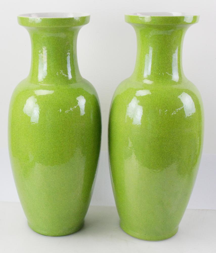 This is a good pair of Chinese green crackle glaze ceramic vases circa 1900.
Both vases have a baluster shape with a flared rim and are unembellished.
The vases have a bright green crackle glaze ground. Both vases are unmarked on the base.  They are
