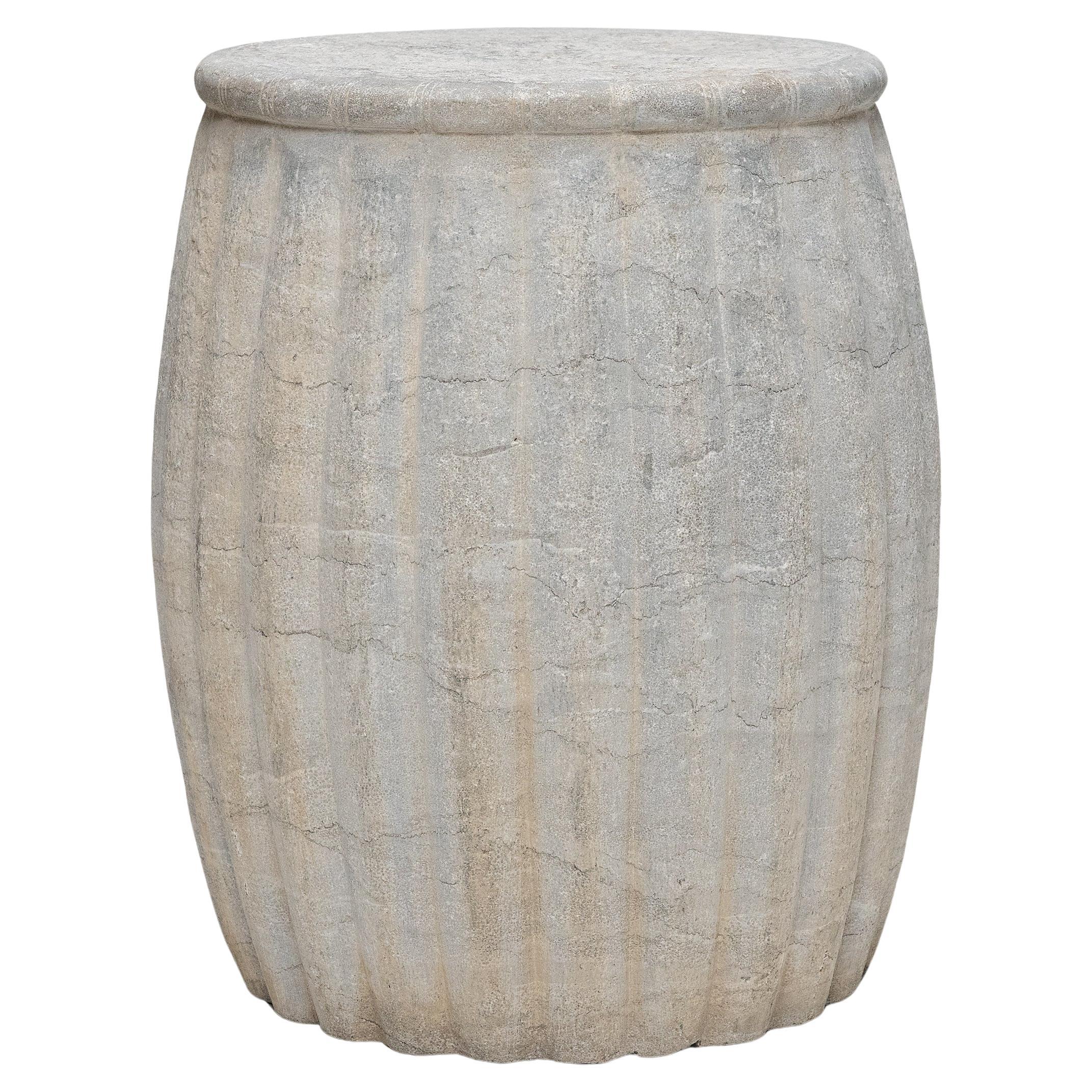 Drum-form stools such as these were traditionally used in gardens and outdoor pavilions where upper class scholars read, wrote, gathered for discussion and, in general, developed their inner sensibilities. This contemporary example is carved from