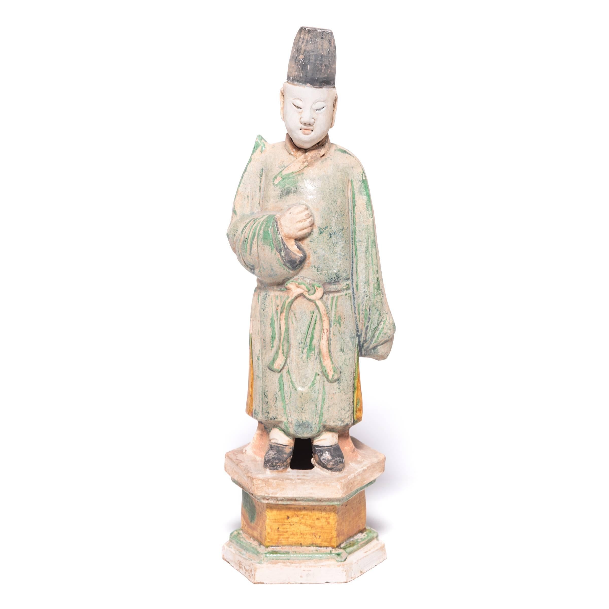 This remarkable pair of attendant figures came to us from a Chicago-area collector devoted to mingqi. Depicting the pleasures of daily life, these ceramic figures were offerings to ensure special treatment in the afterlife. Coated with green, amber,