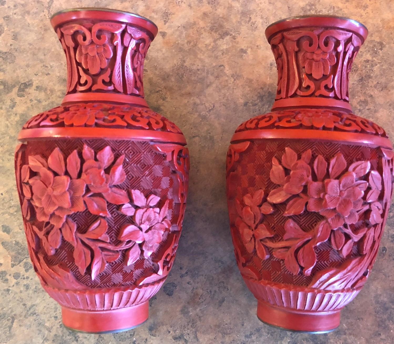 A very well crafted pair of Chinese mirror image cinnabar lacquered vases, circa 1950's. The vases are 5