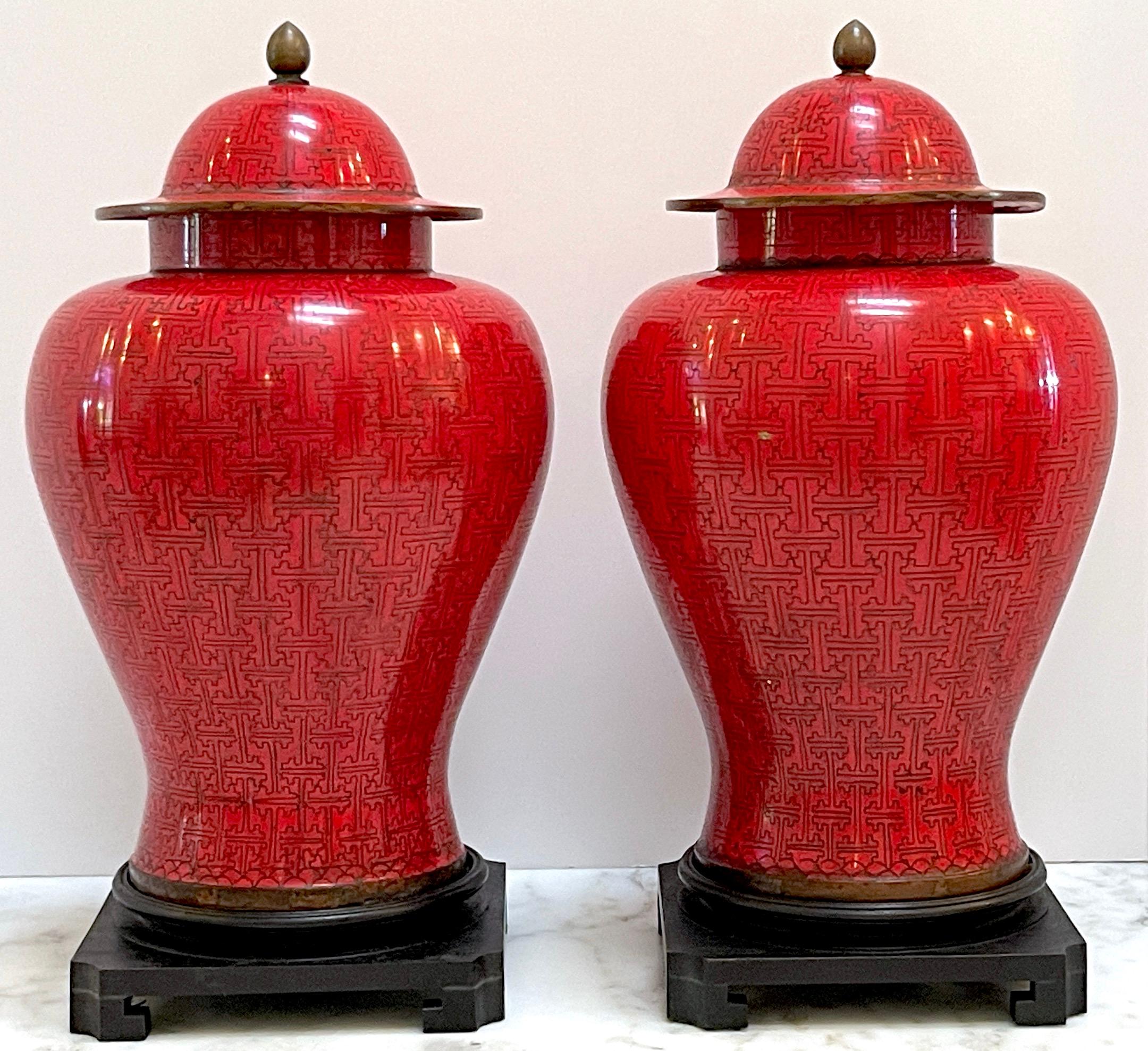 Pair of Chinese Modernist Red Cloisonné Ginger Jars and Stands, Circa 1960s  
China, 20th Century

A stunning pair of Chinese Modernist red cloisonné ginger jars and stands, crafted in China during the 1960s. These large jars exemplify the perfect