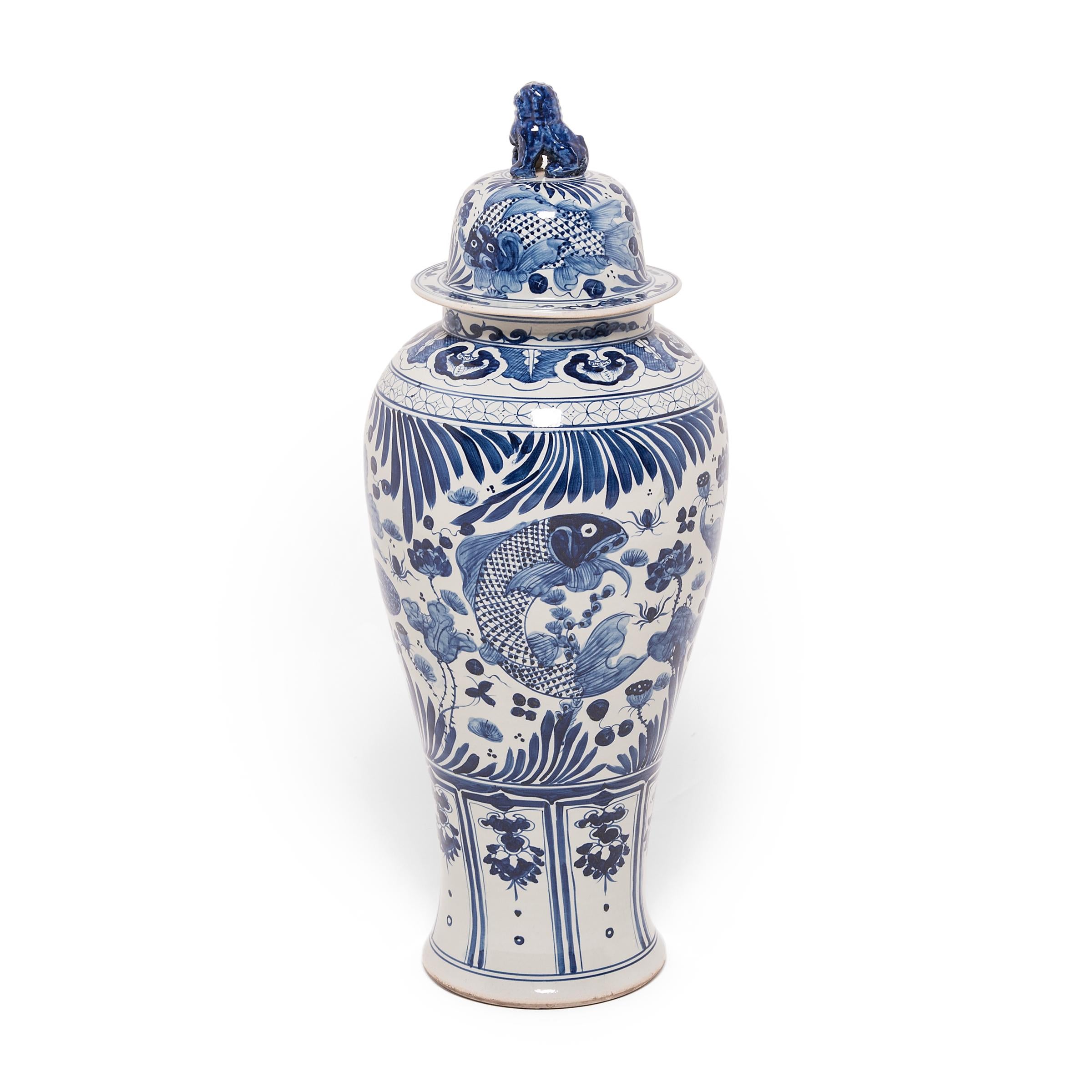 These grand, blue-and-white porcelain jars are hand-painted with flora and fauna of the sea, offering blessings of wealth, abundance, the content harmony of a fish in water. Chinese blue-and-white ceramics have inspired ceramists worldwide since