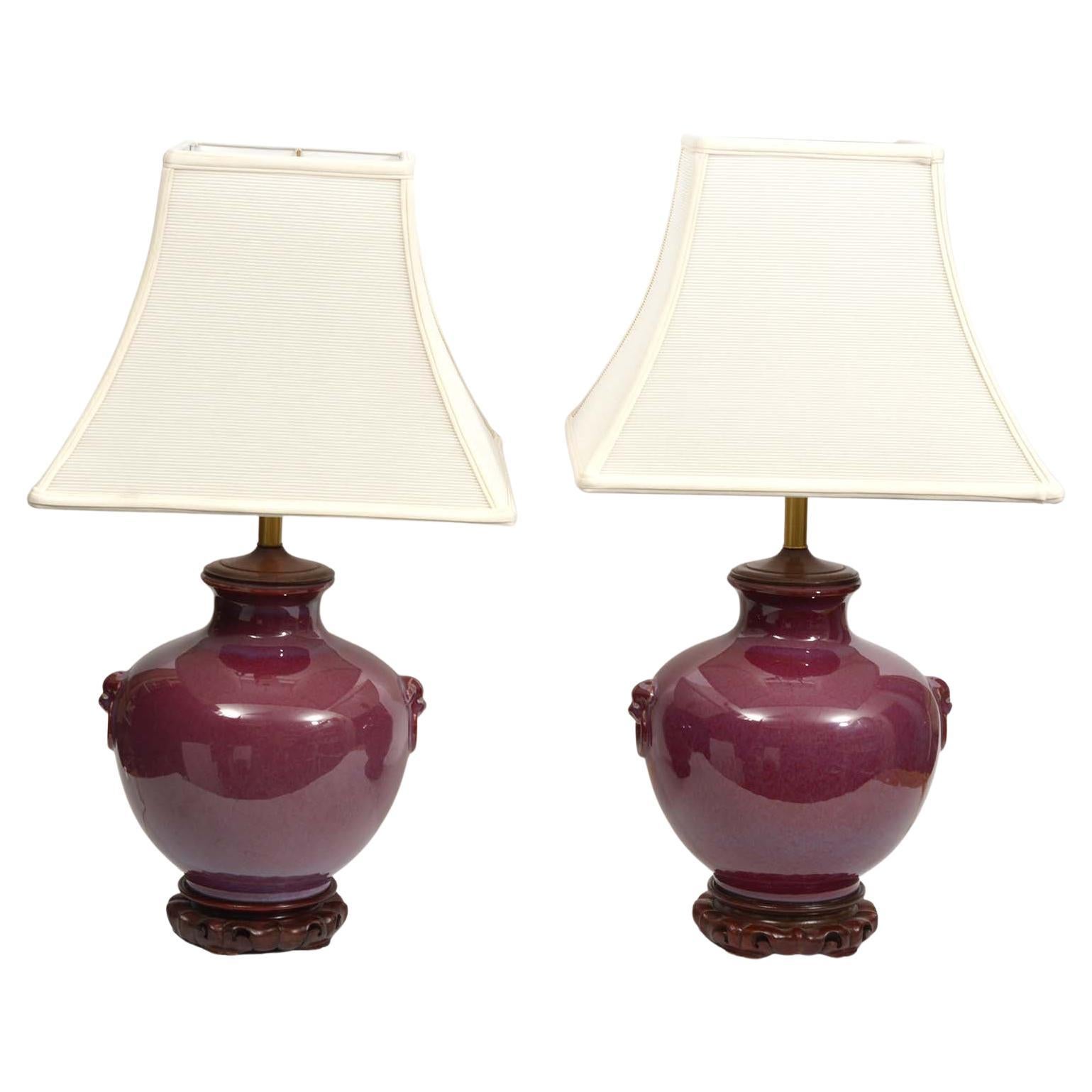 Pair of Chinese Oxblood Glazed Urn Shaped Table Lamps with Haut Relief, 20th C
