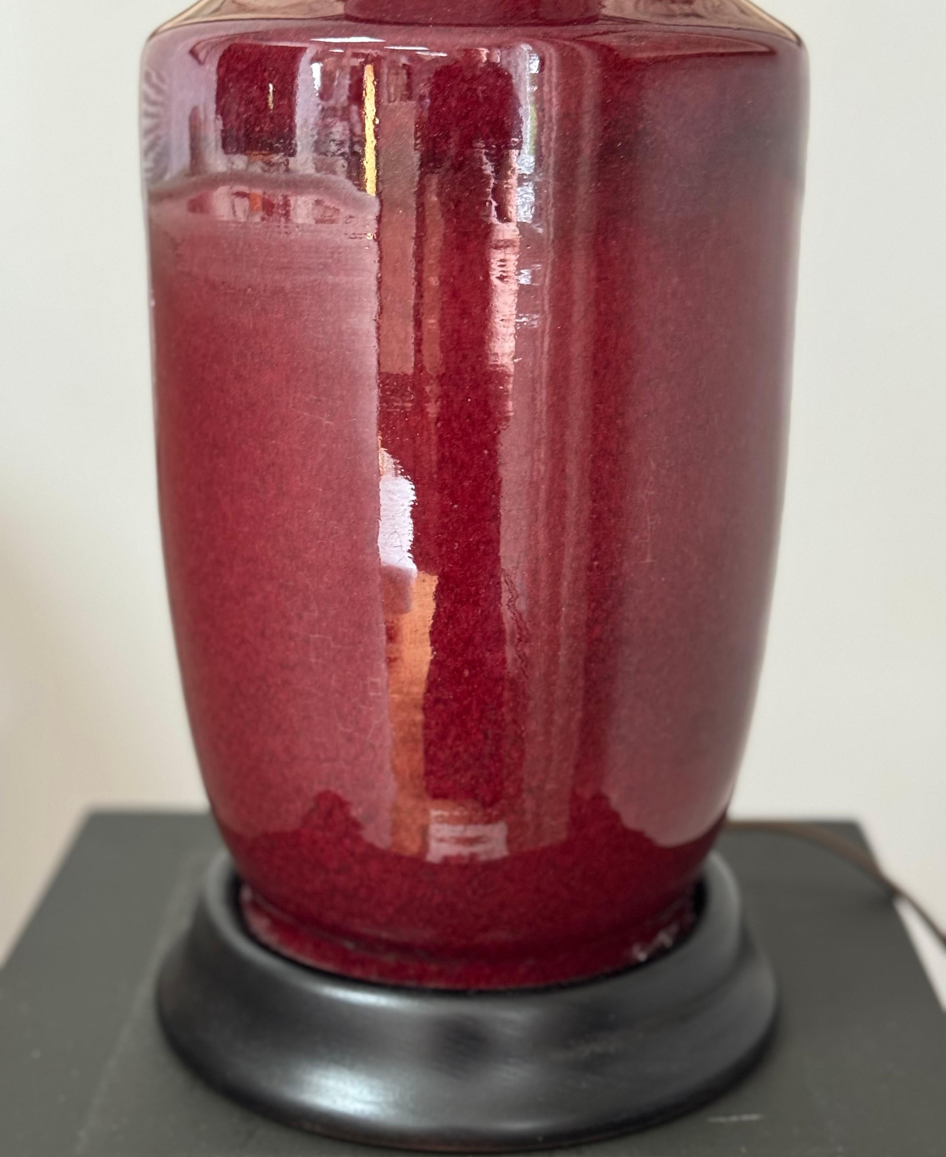 Cast Pair of Chinese Oxblood Rouleau Lamps For Sale