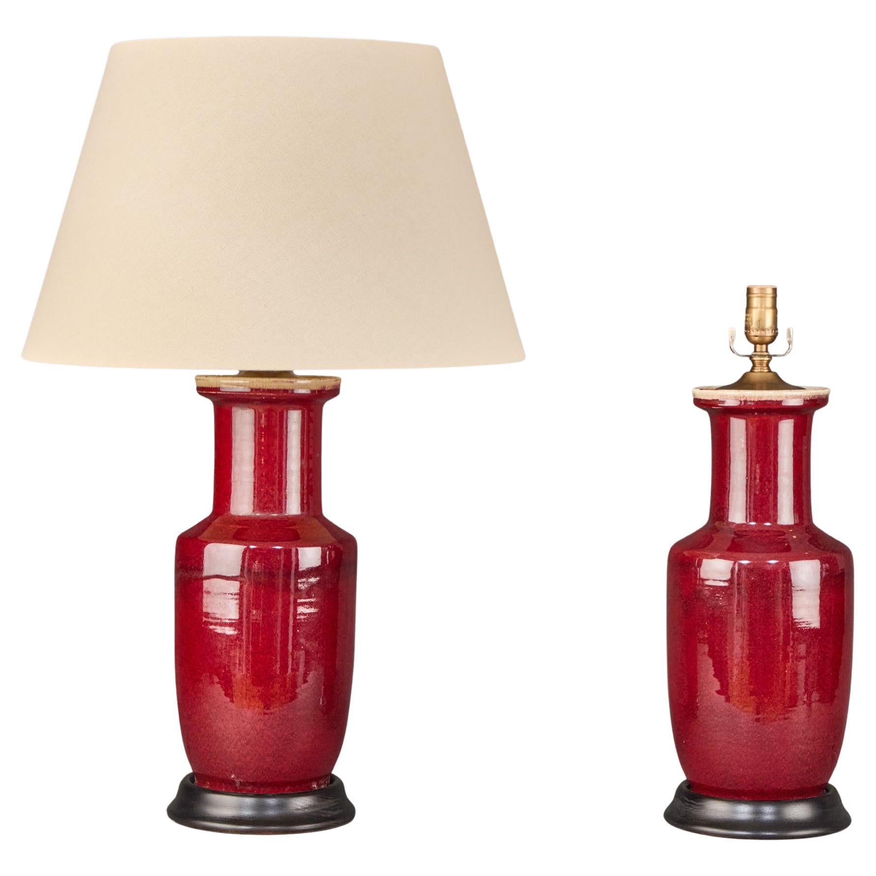 Pair of Chinese Oxblood Rouleau Lamps For Sale