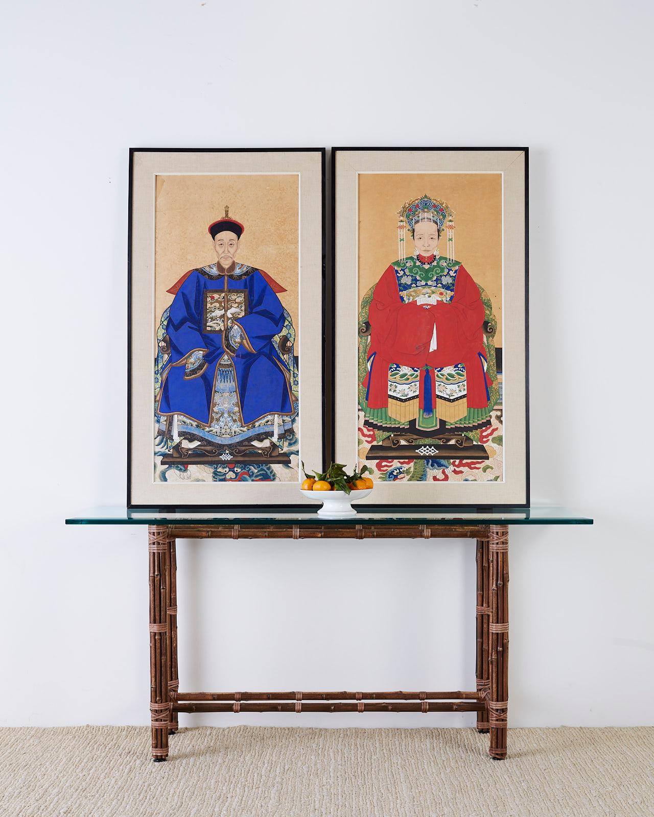 Colorful pair of Chinese ancestor portraits depicting a patriarch and matriarch of high ranking official status. Both seated wearing beautifully decorated robes and hats. Mounted in ebonized wood frames with linen borders. From an estate in San