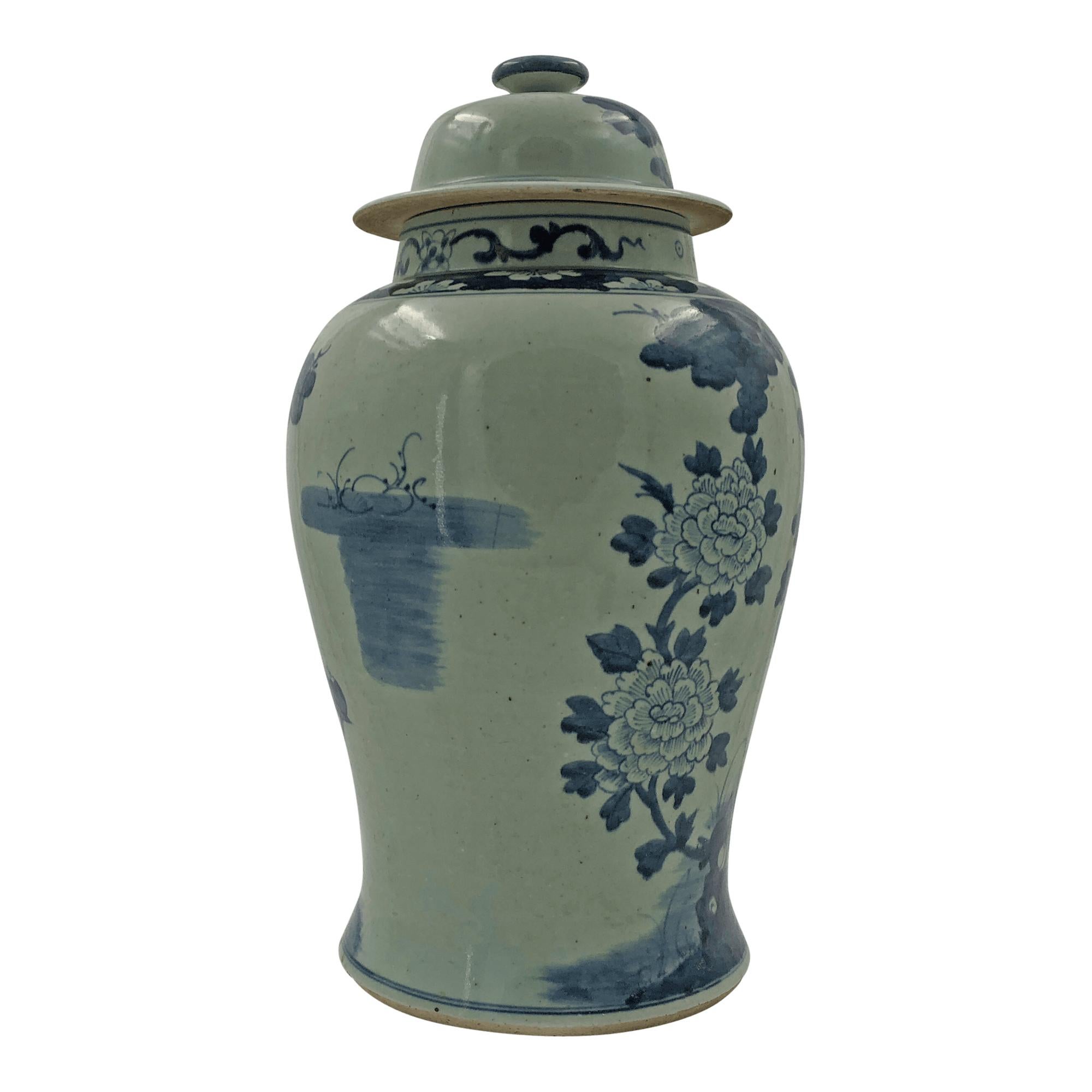 A pair of large Chinese export blue and white lidded Temple jars decorated with Pheasants playing in the woods.