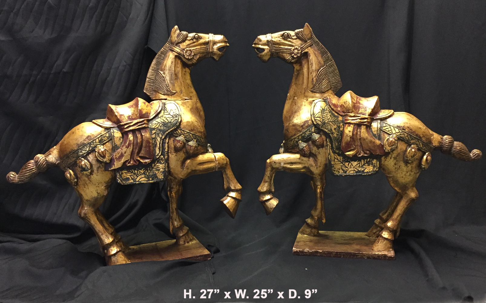 Opposing pair of Chinese polychrome painted and finely carved giltwood prancing horses.