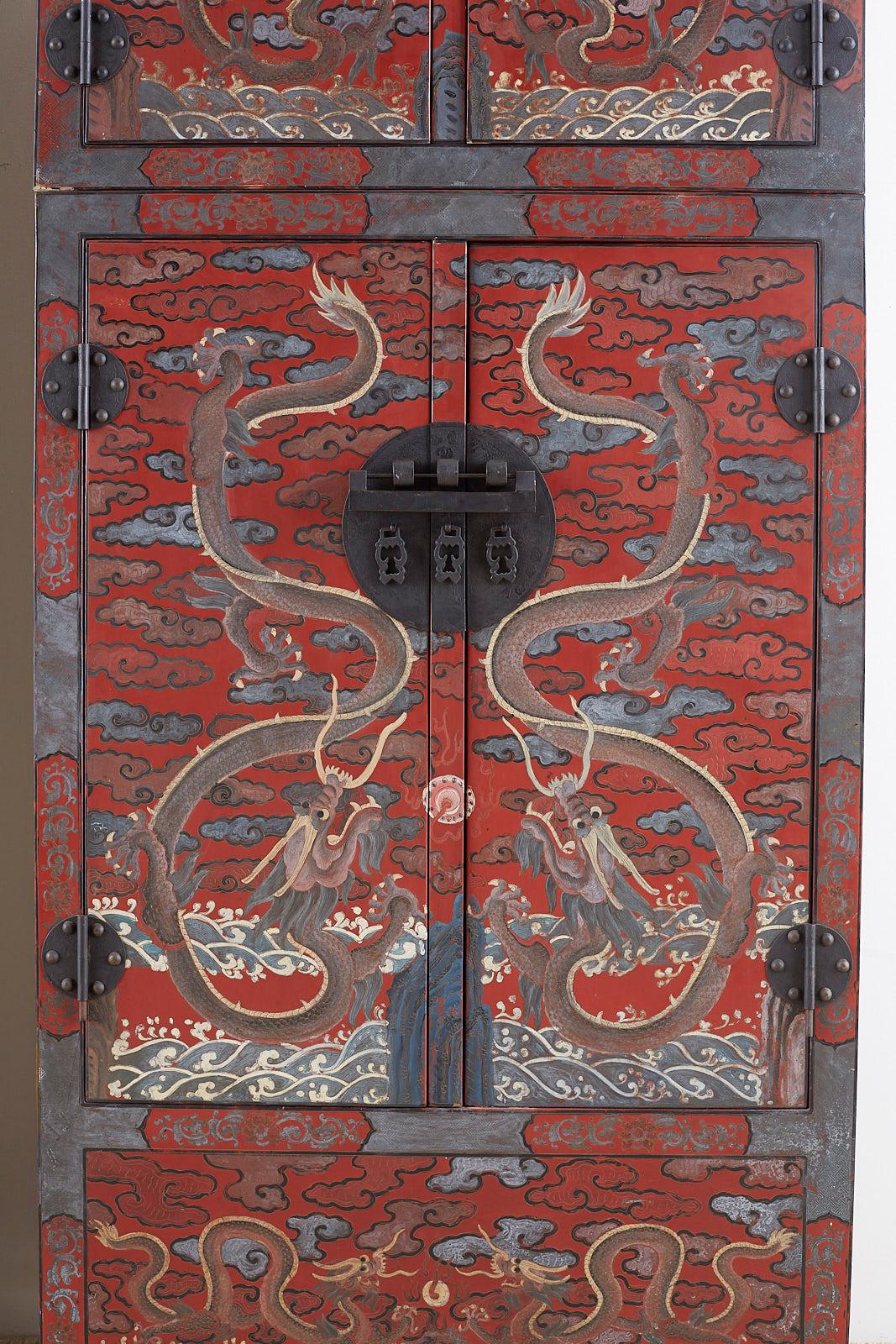 20th Century Pair of Chinese Polychrome Decorated Compound Dragon Cabinets