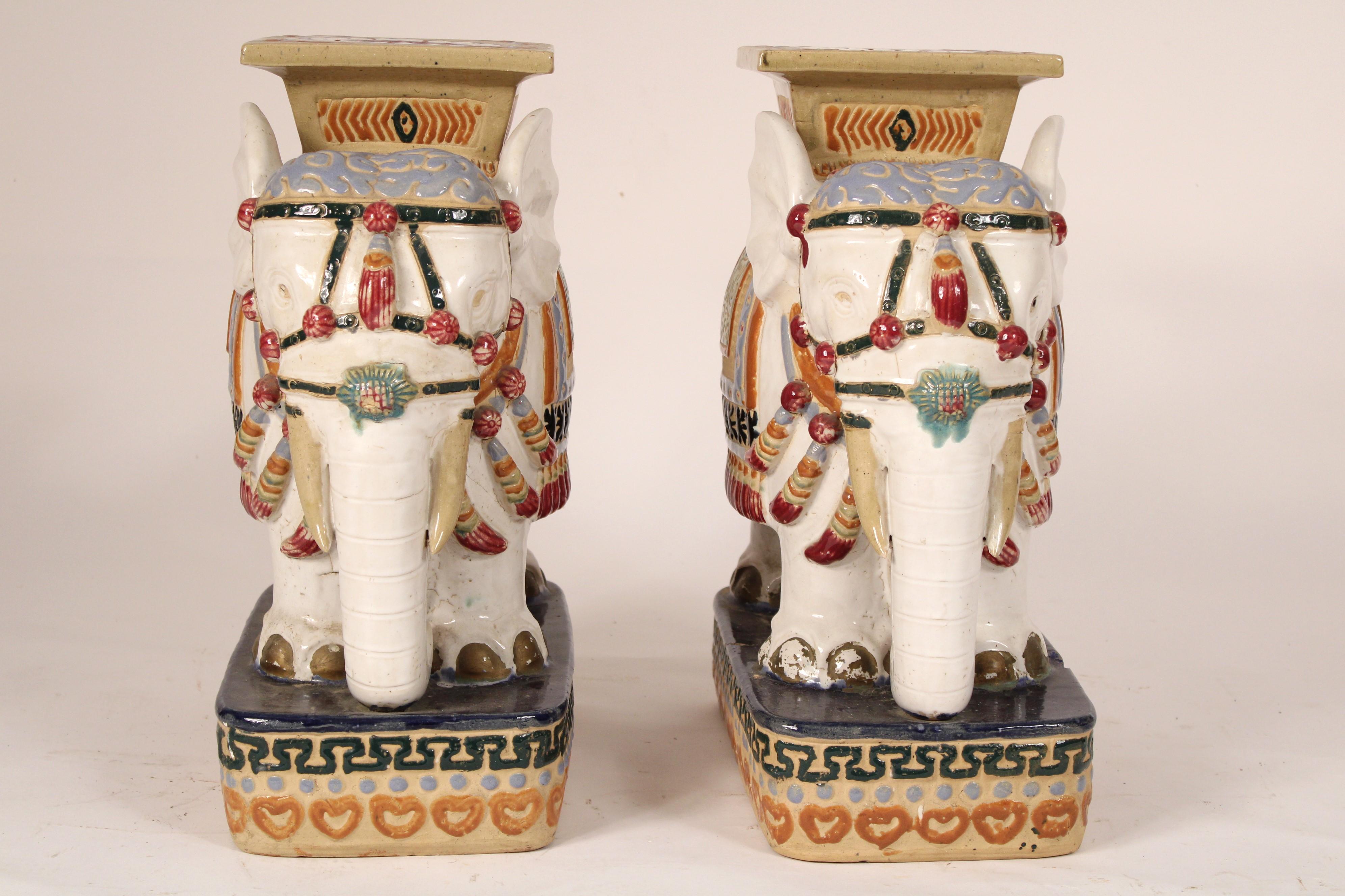 Pair of Chinese polychrome decorated stoneware elephant form garden seats, circa late 20th century. 