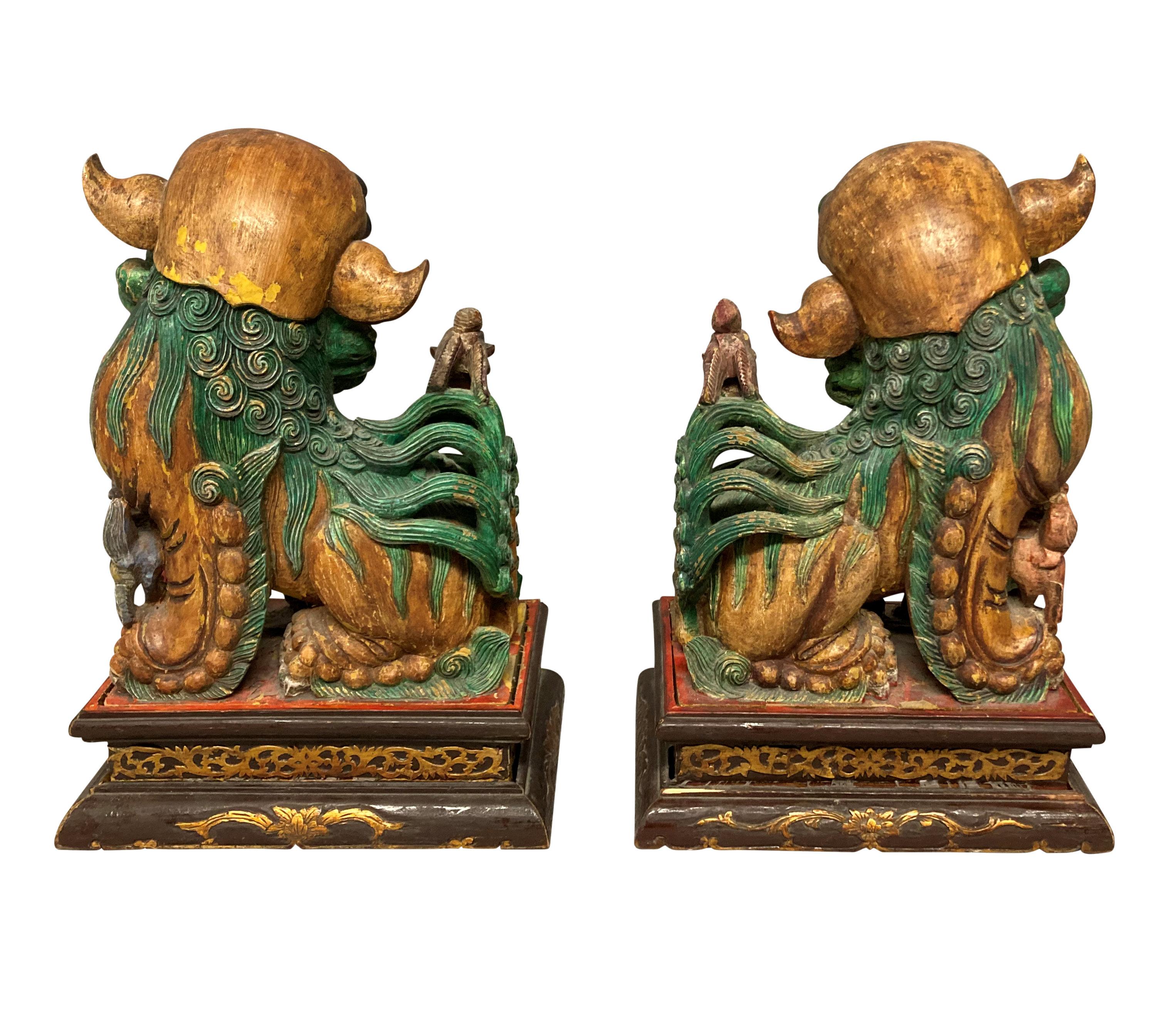 Pair of Chinese Polychrome Painted Foo Dogs In Good Condition In London, GB