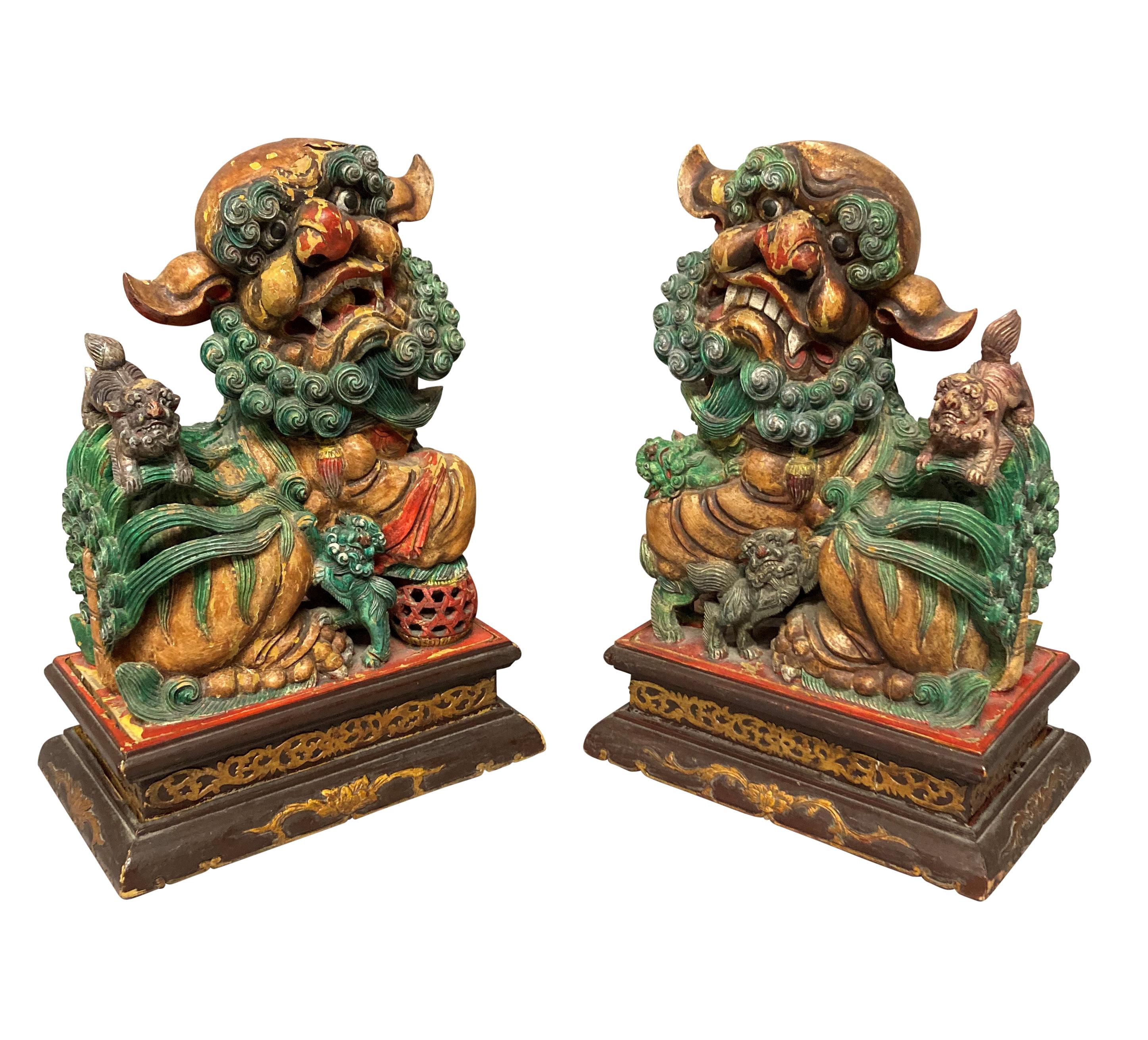 Hardwood Pair of Chinese Polychrome Painted Foo Dogs