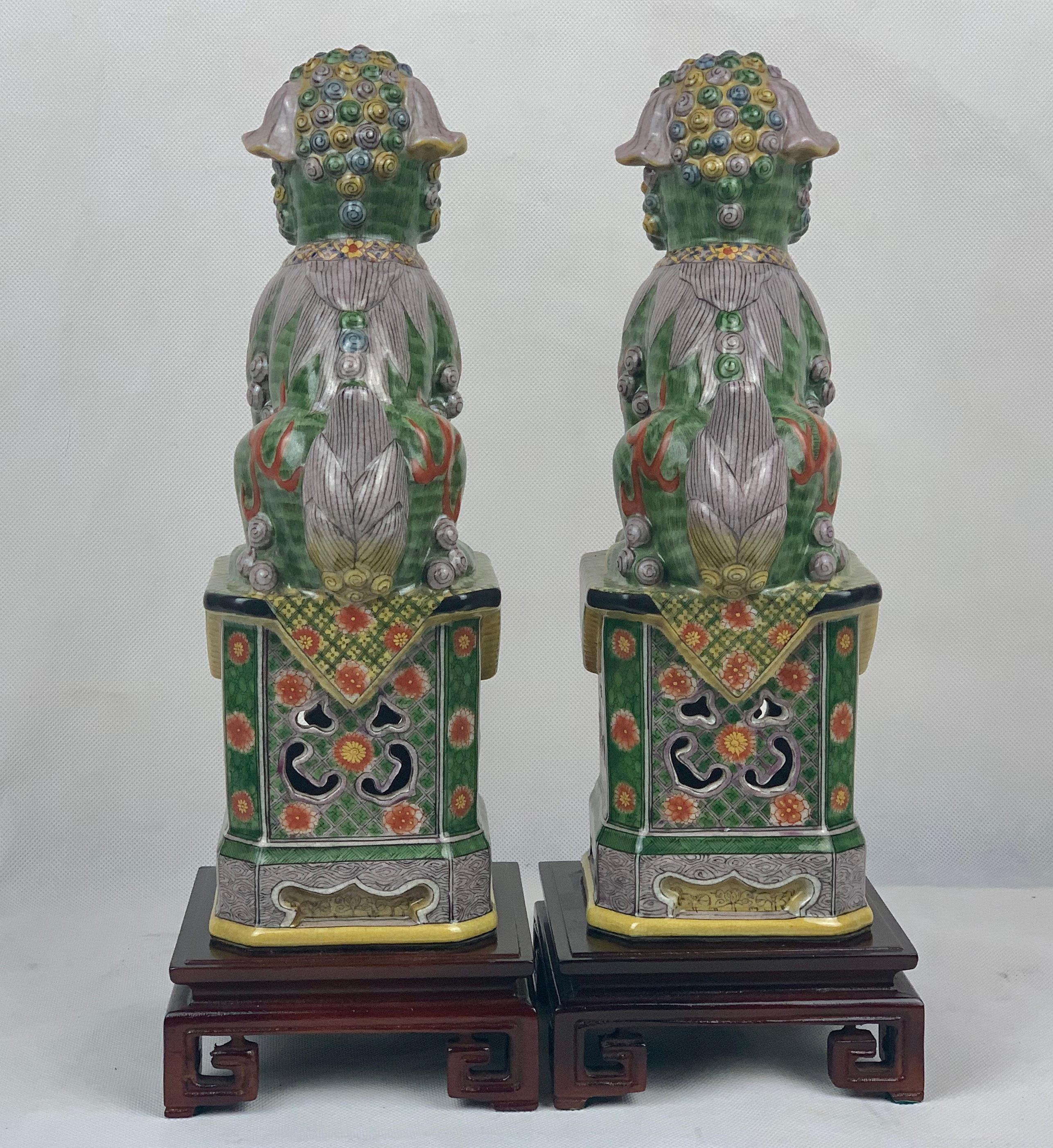 Hand-Crafted Pair of Polychromed Porcelain Chinese Foo Dogs on Stands-Green, Yellow, Red
