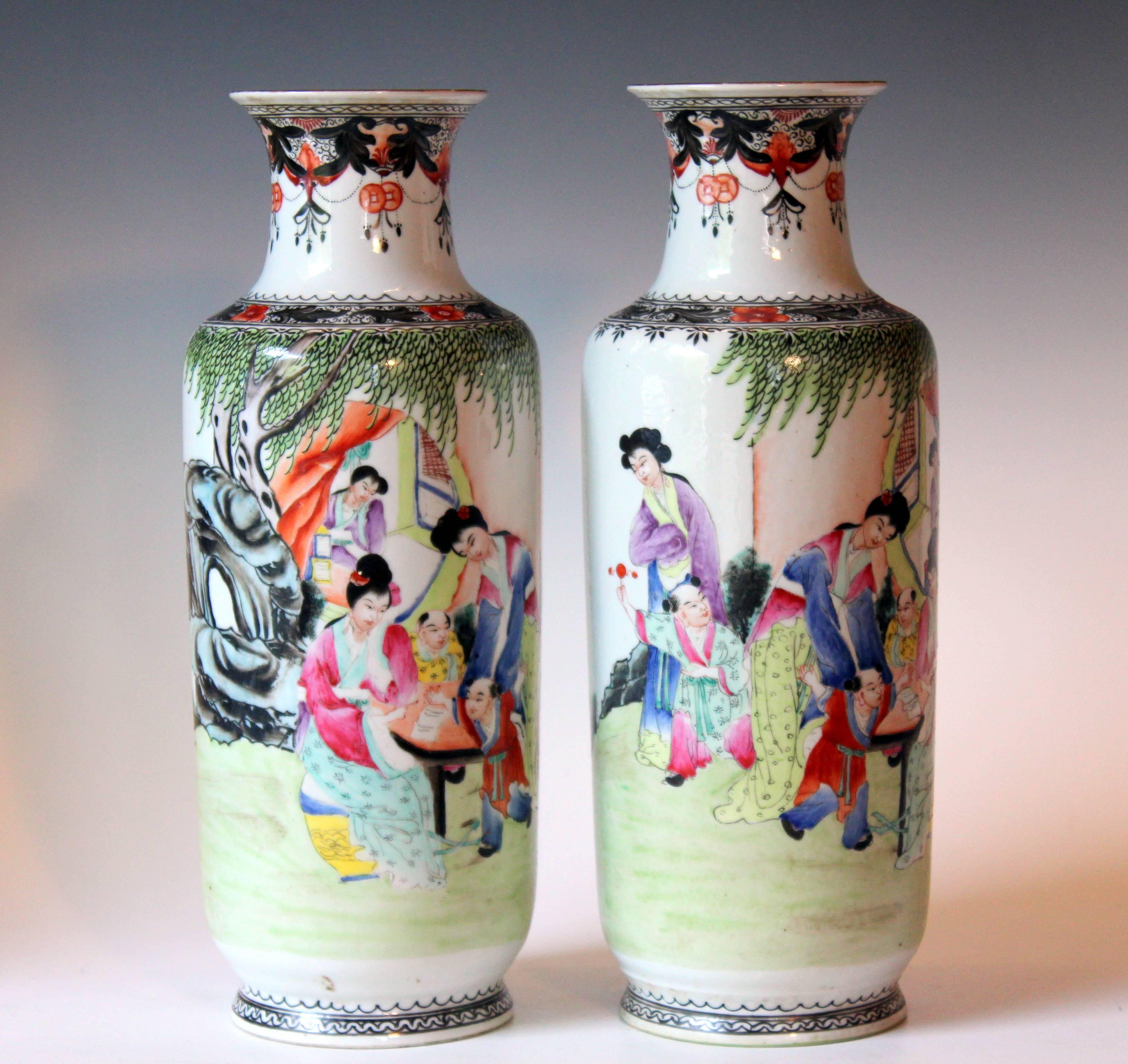 Mirror matched pair of antique Chinese porcelain famille rose vases with continuous scene women and children playing in the garden. With Seal Marks on reverse and base, early 20th century. Nice quality painting. Measure: 13 1/4