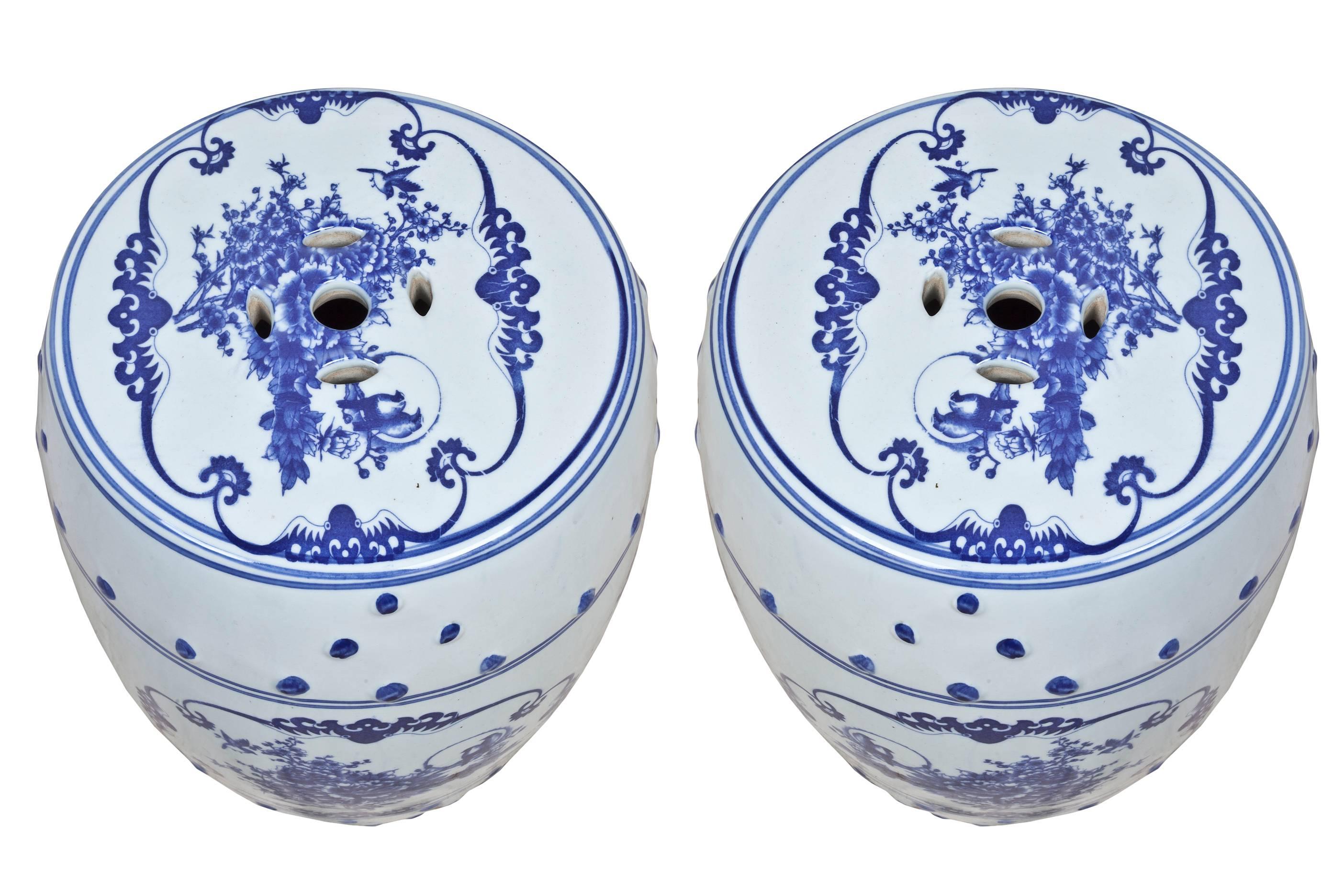 Pair of blue and white Chinese porcelain garden seats or side tables with floral motif, mid-1900s. Excellent condition.