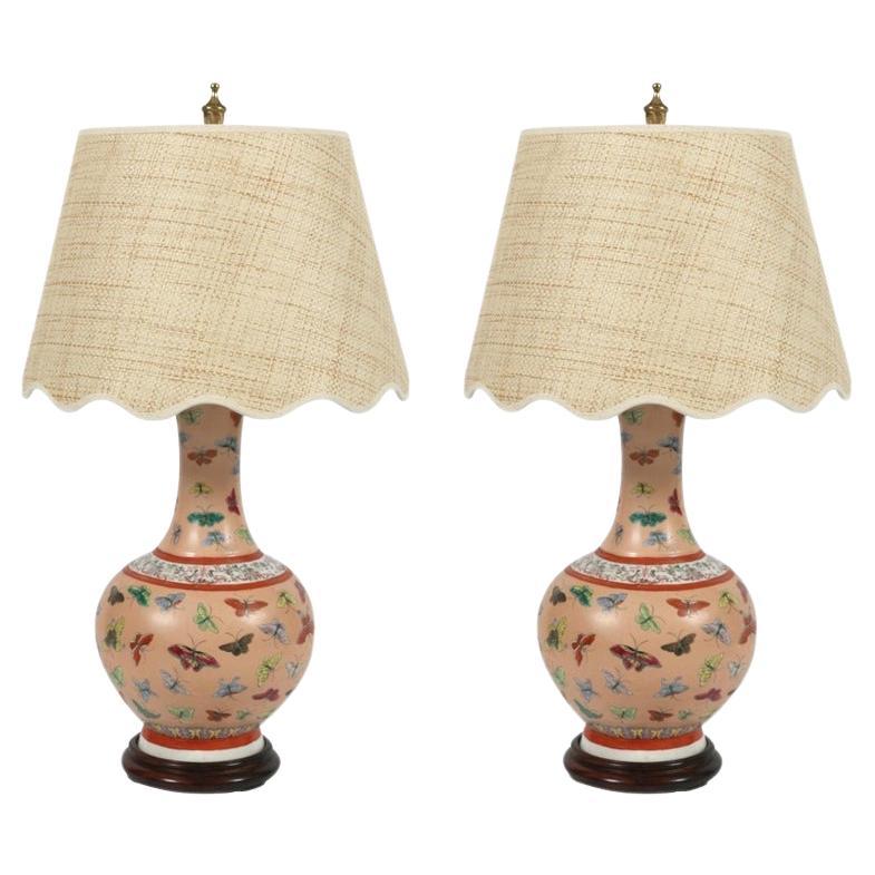 Pair of Chinese Porcelain Lamps with Butterflies on Wood Base