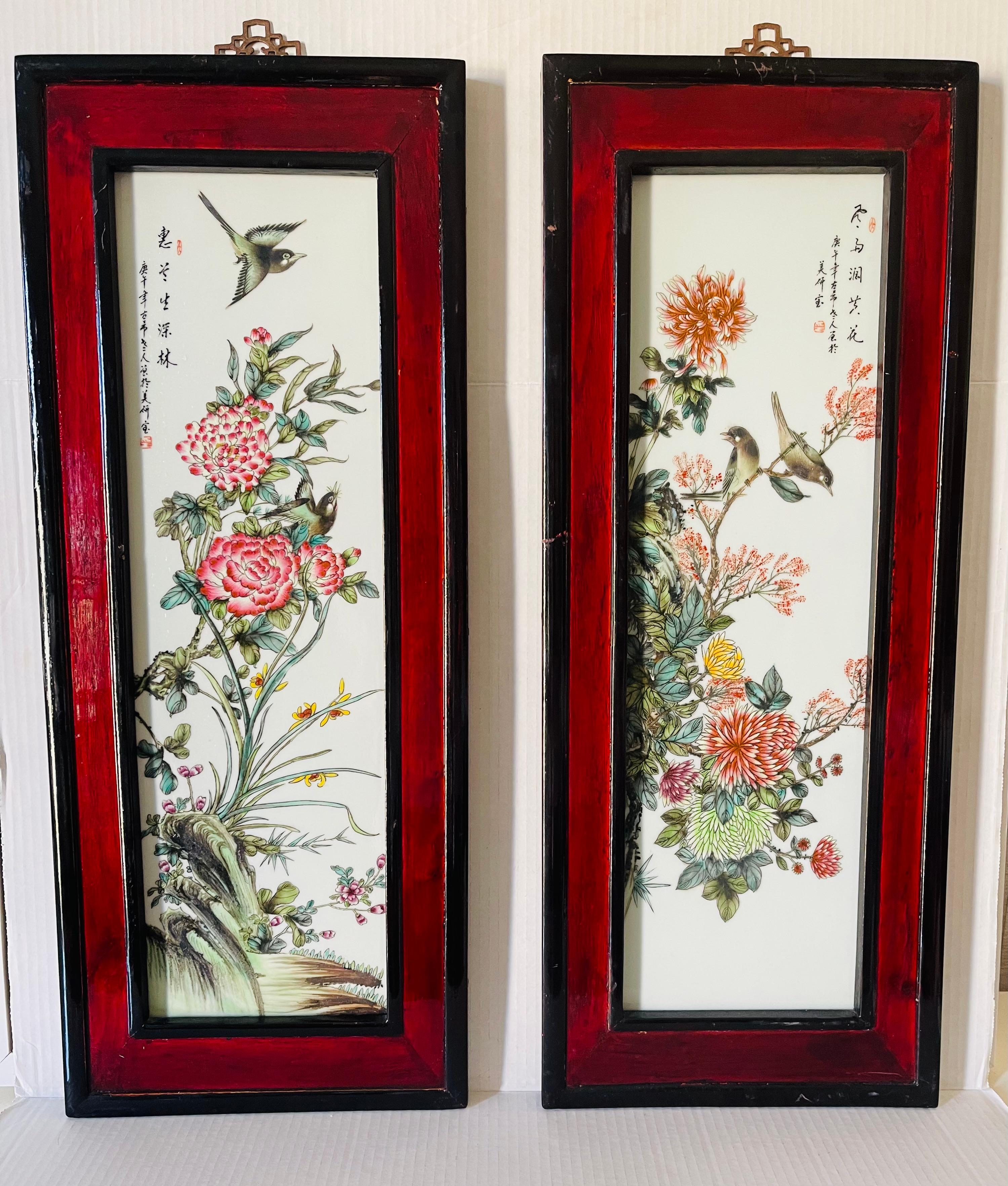 Pair of antique Chinese Qing Dynasty porcelain polychrome plaques, pai ted with flowers and si ging birds. Signed and inscribed in Chinese upper right and left corners. Framed in red wood mahogany profile frames, Great condition.