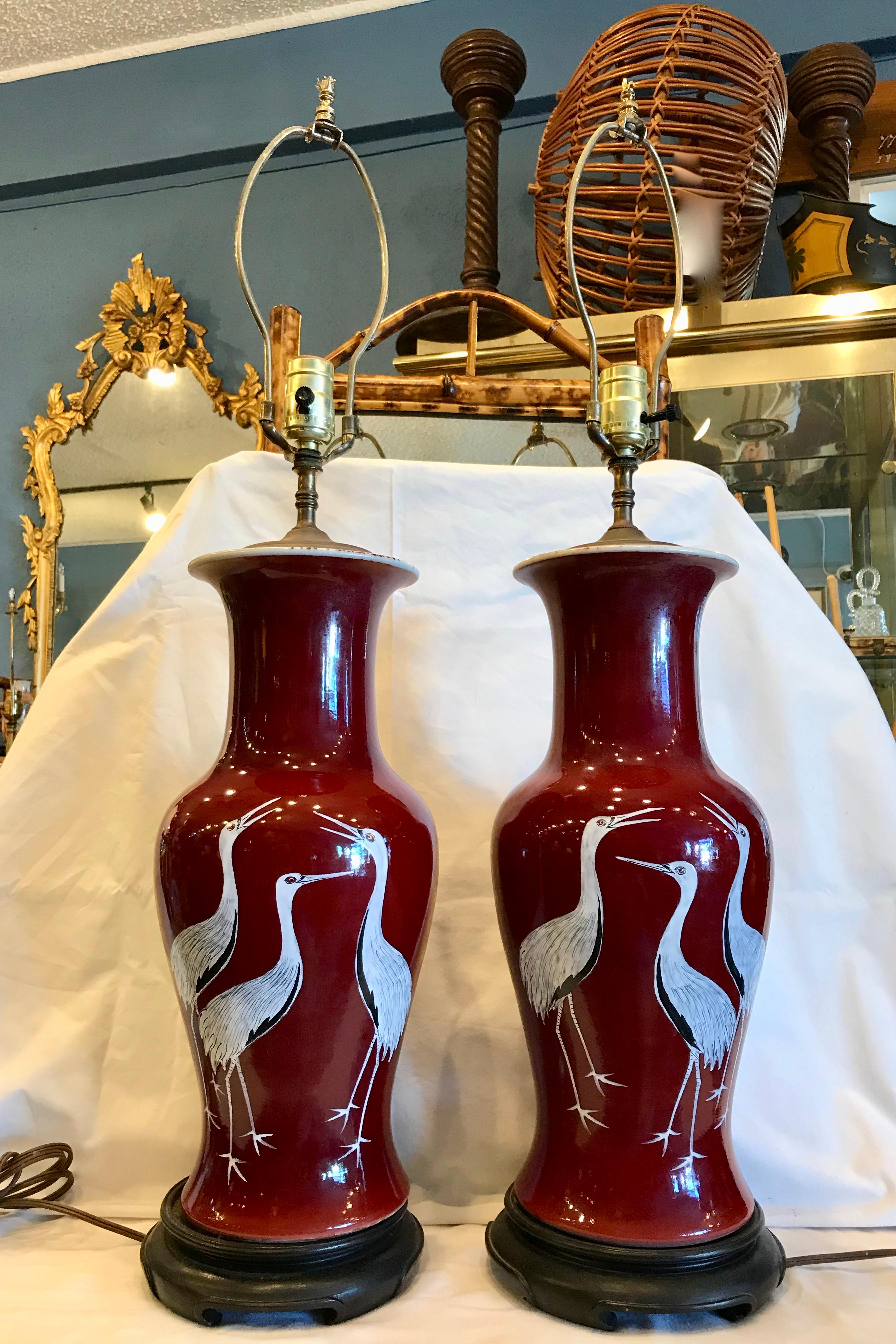 The vases - now electrified are appointed with hand painted cranes -
a stunning accent. Classic blood red color. Nicely scaled.