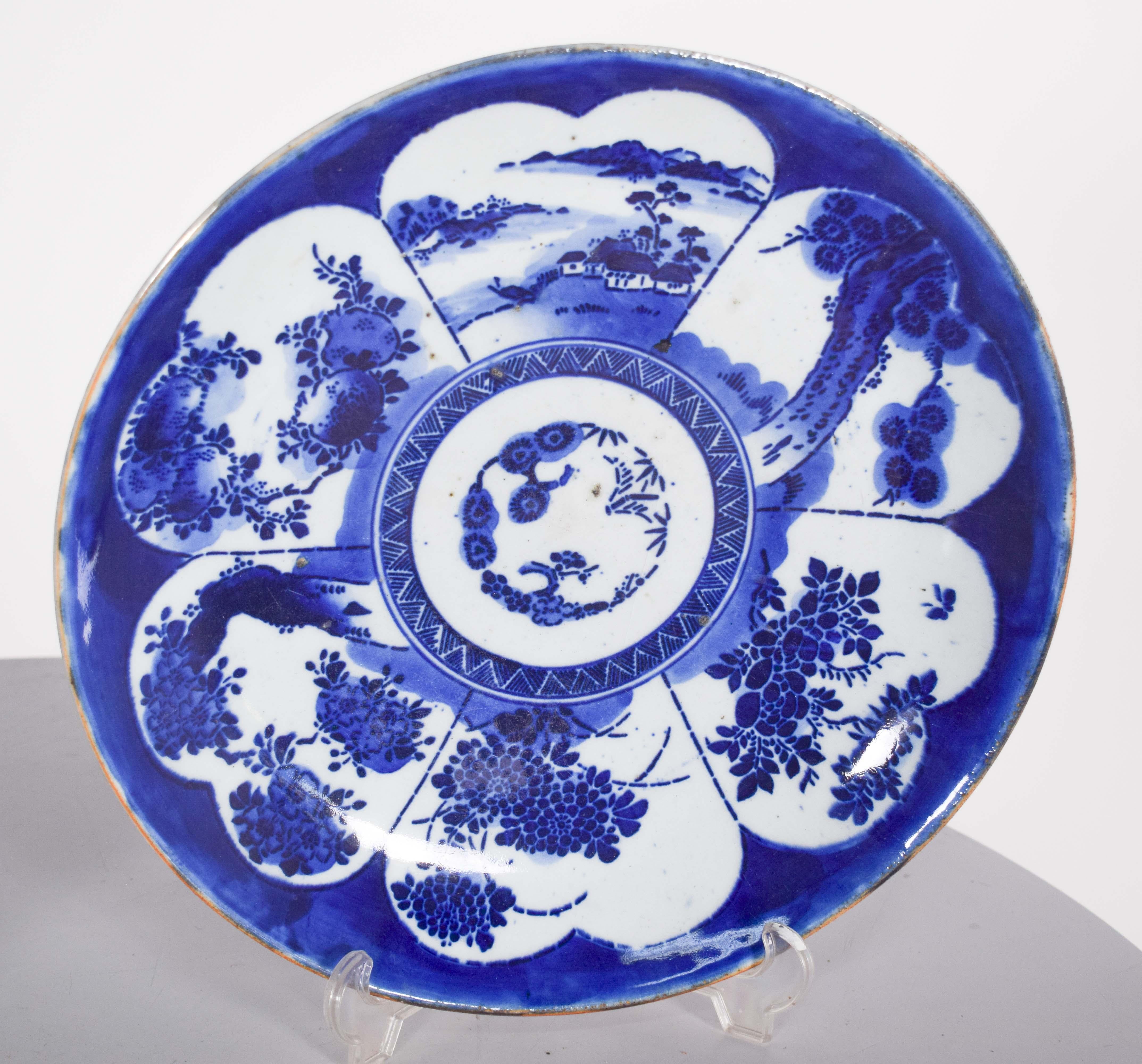 This pair of porcelain serving bowls features an intricate and elegant design characteristic of traditional Chinese blue and white ceramics. The exclusive use of cobalt blue on a white background is a characteristic of Chinese export porcelain,