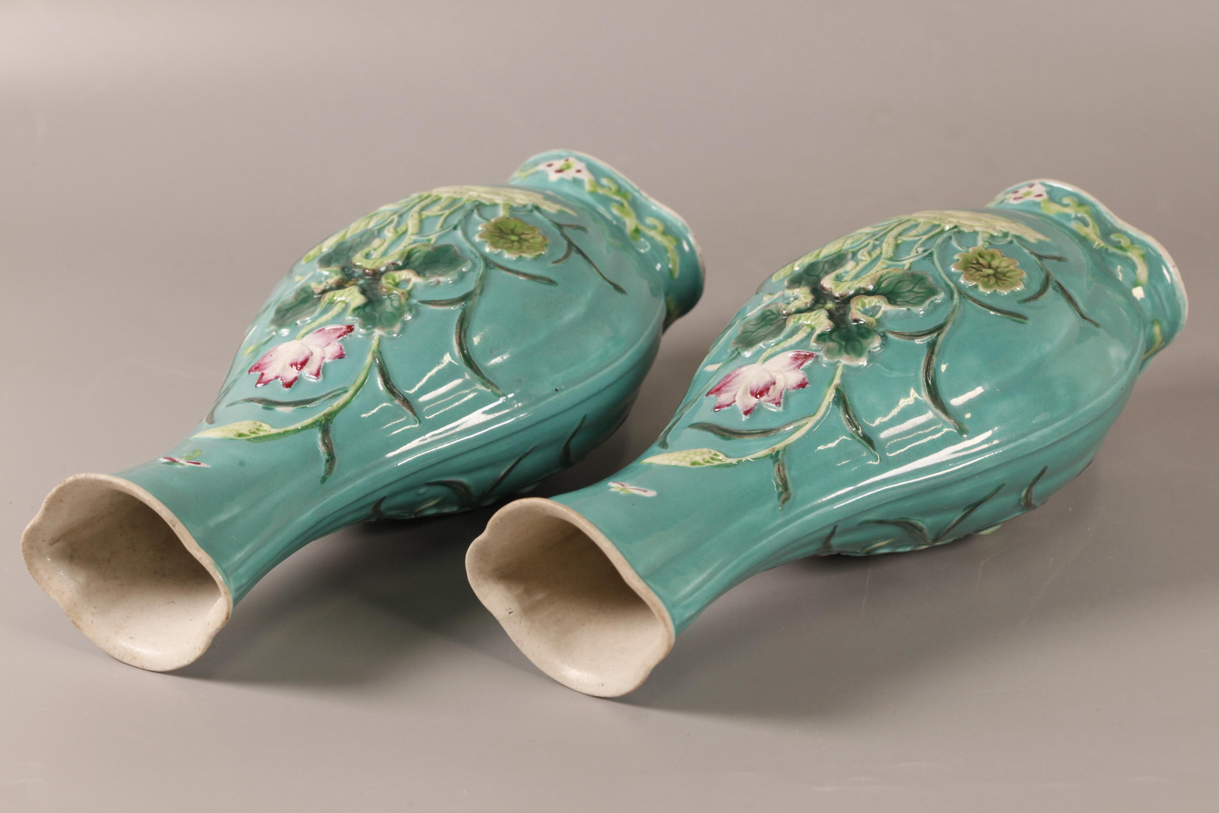 floral motif in relief on turquoise ground