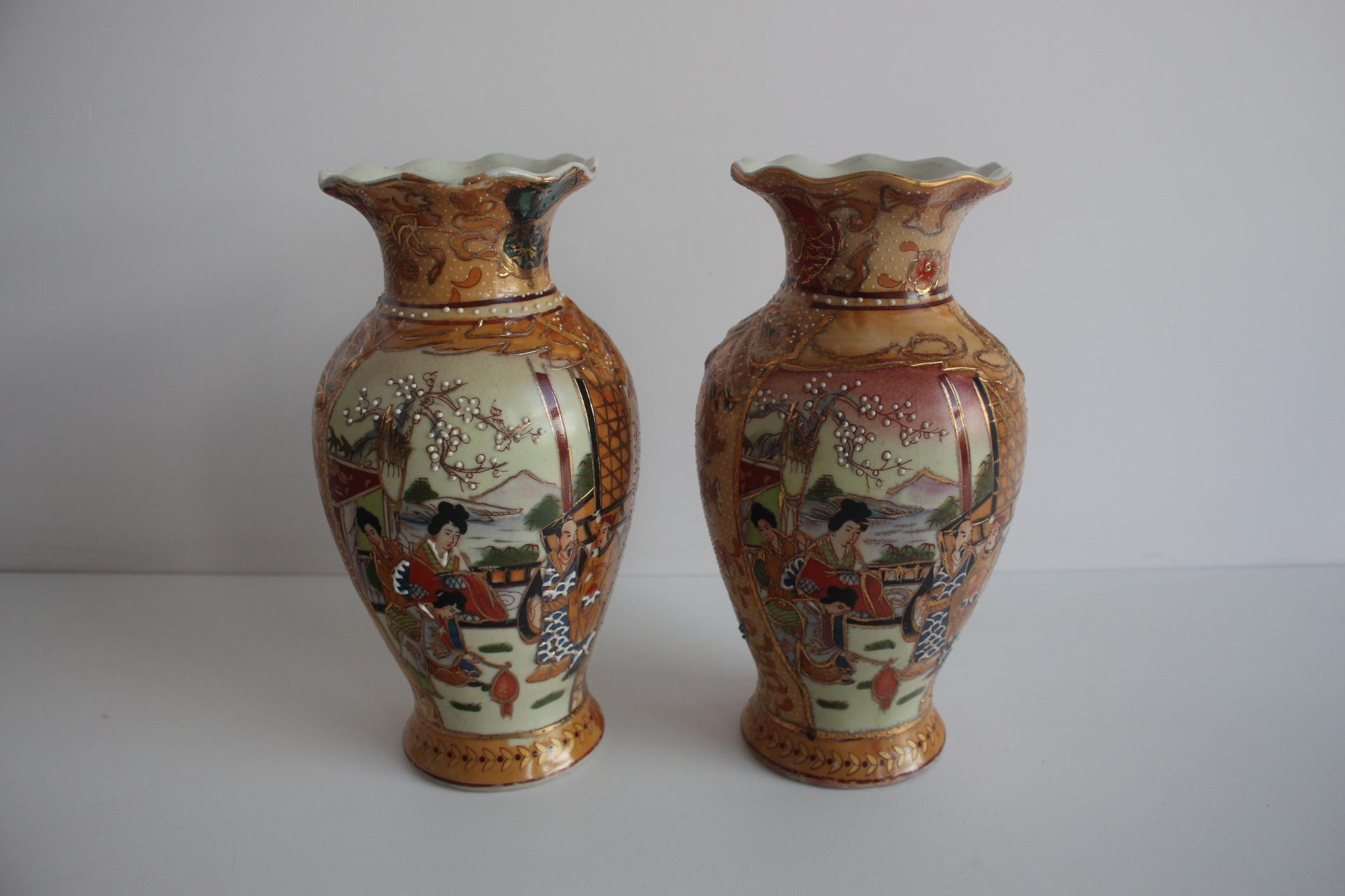 The vases are hand-decorated with painted scenes, figures in kimonos.
In the background you can see landscapes, mountains, trees.
The decoration is richly interwoven with gold color and fine lines very typical for Satsuma ceramics
Signed
Original