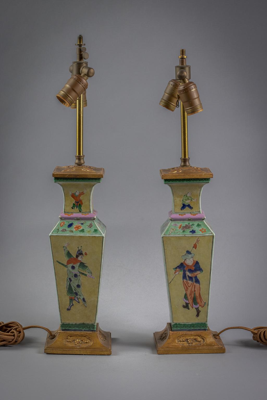 Each body and neck with different Chinese figures, the shoulder with flowers on a green ground, With a gilt wood Farmer mounting.