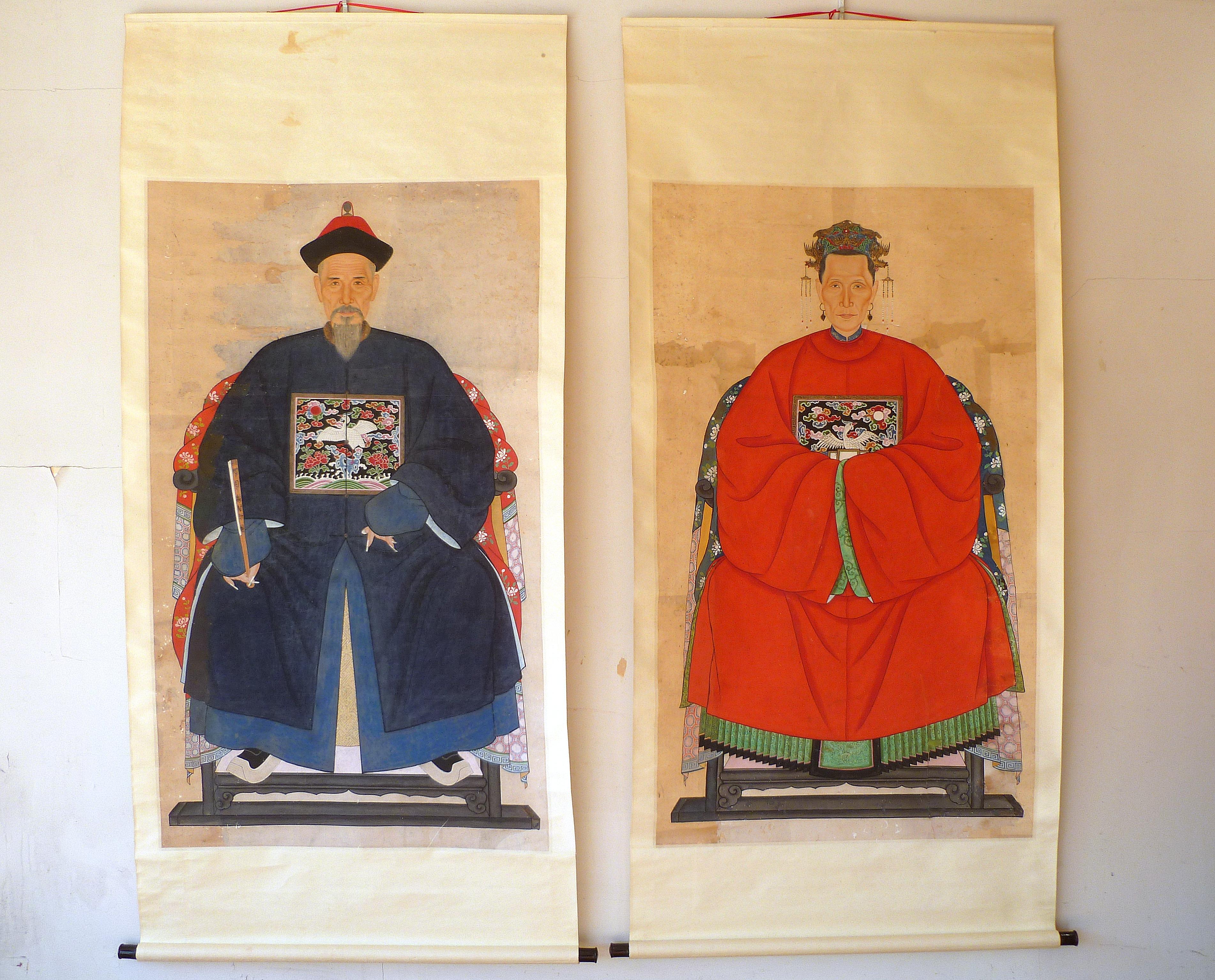 Pair of Chinese Qing dynasty imperial office and wife ancestor portrait paintings.
Very nice detail and fine paintings.
Overall size: Each painting included outer brocade  is 36.5